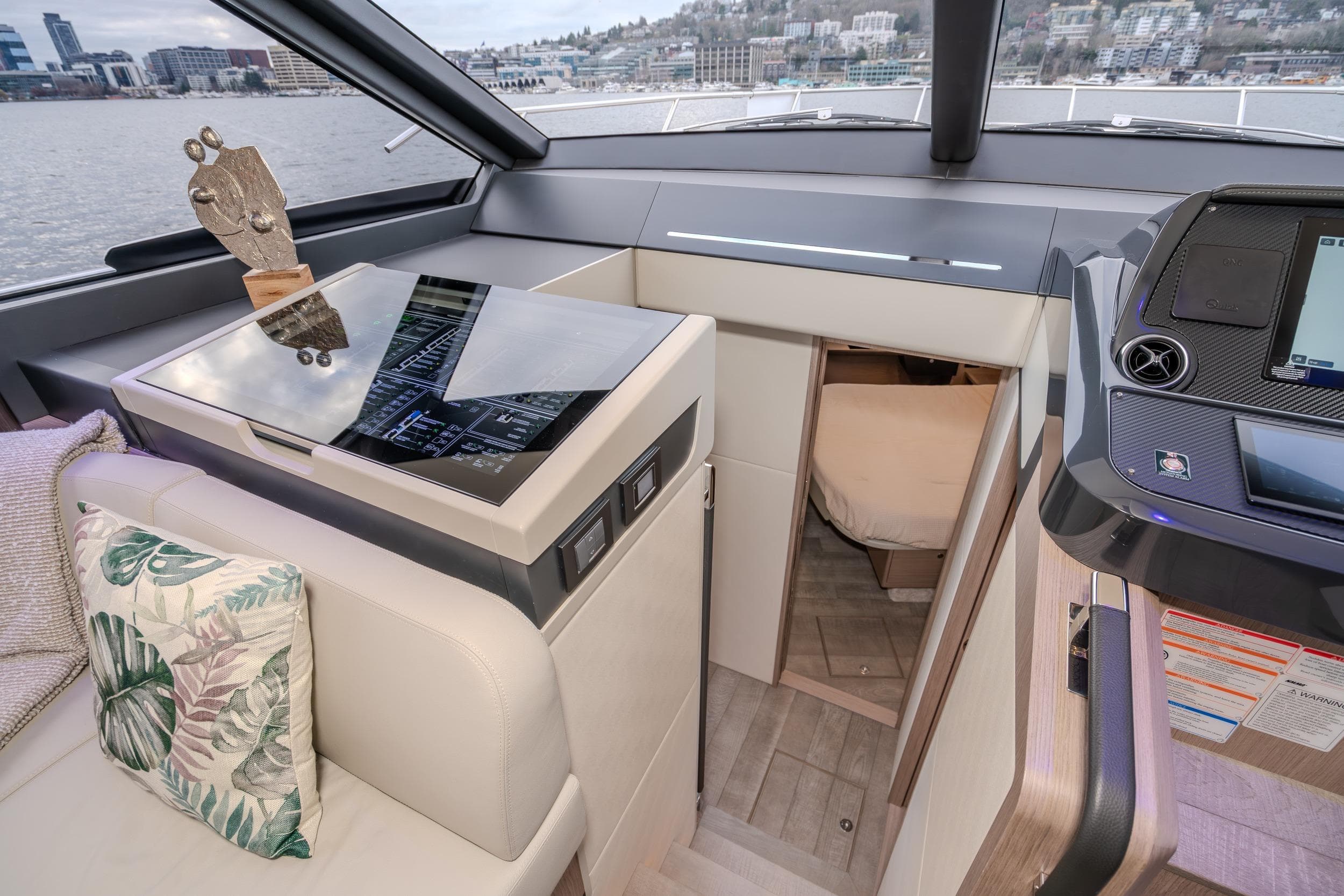 Interior of 2026 Absolute 48 Coupe yacht with modern design and scenic view.