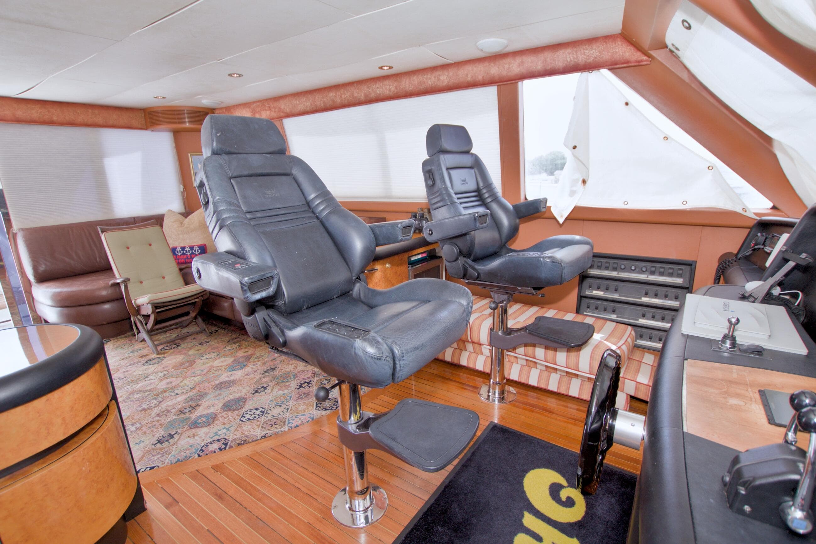 Luxurious interior of 1998 Lazzara 76 Skylounge Grand Salon yacht with leather seating.