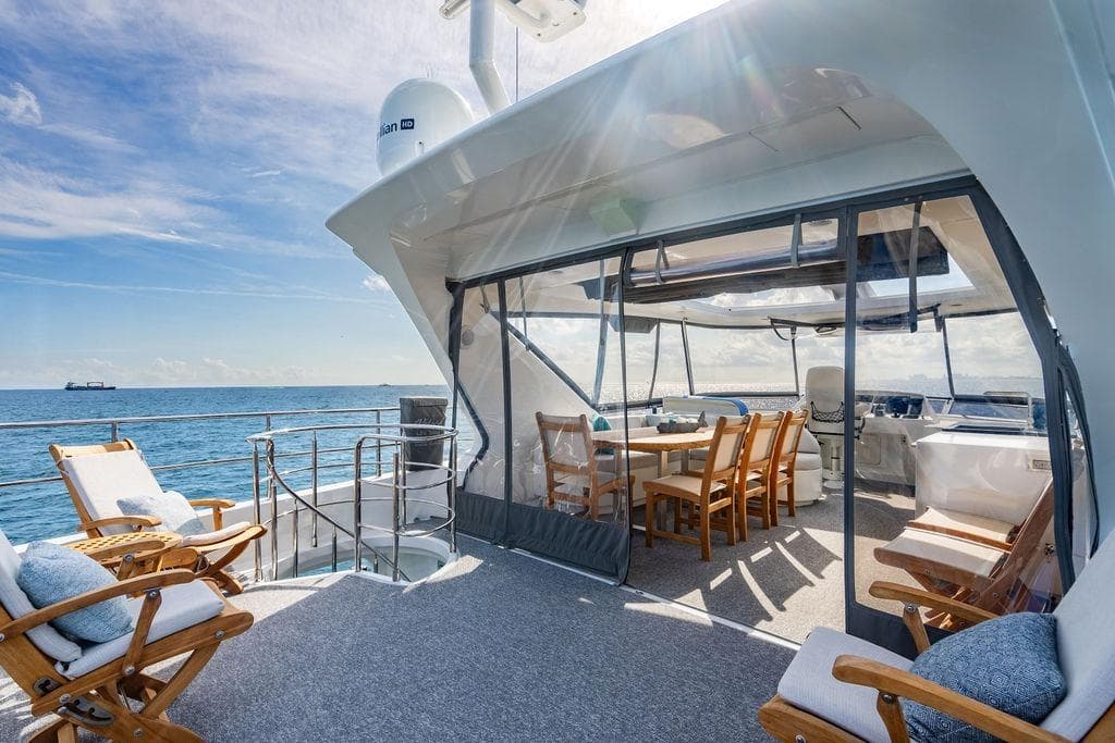 Luxurious Lanzarote Ventuno 73 yacht deck with seating, ocean view, and sunny sky, 2013 model.