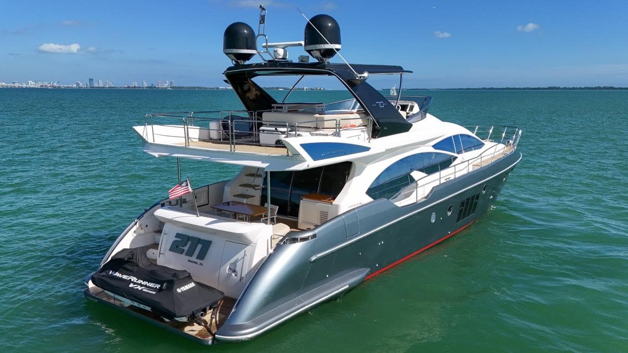 2012 Azimut Flybridge yacht cruising on open water.