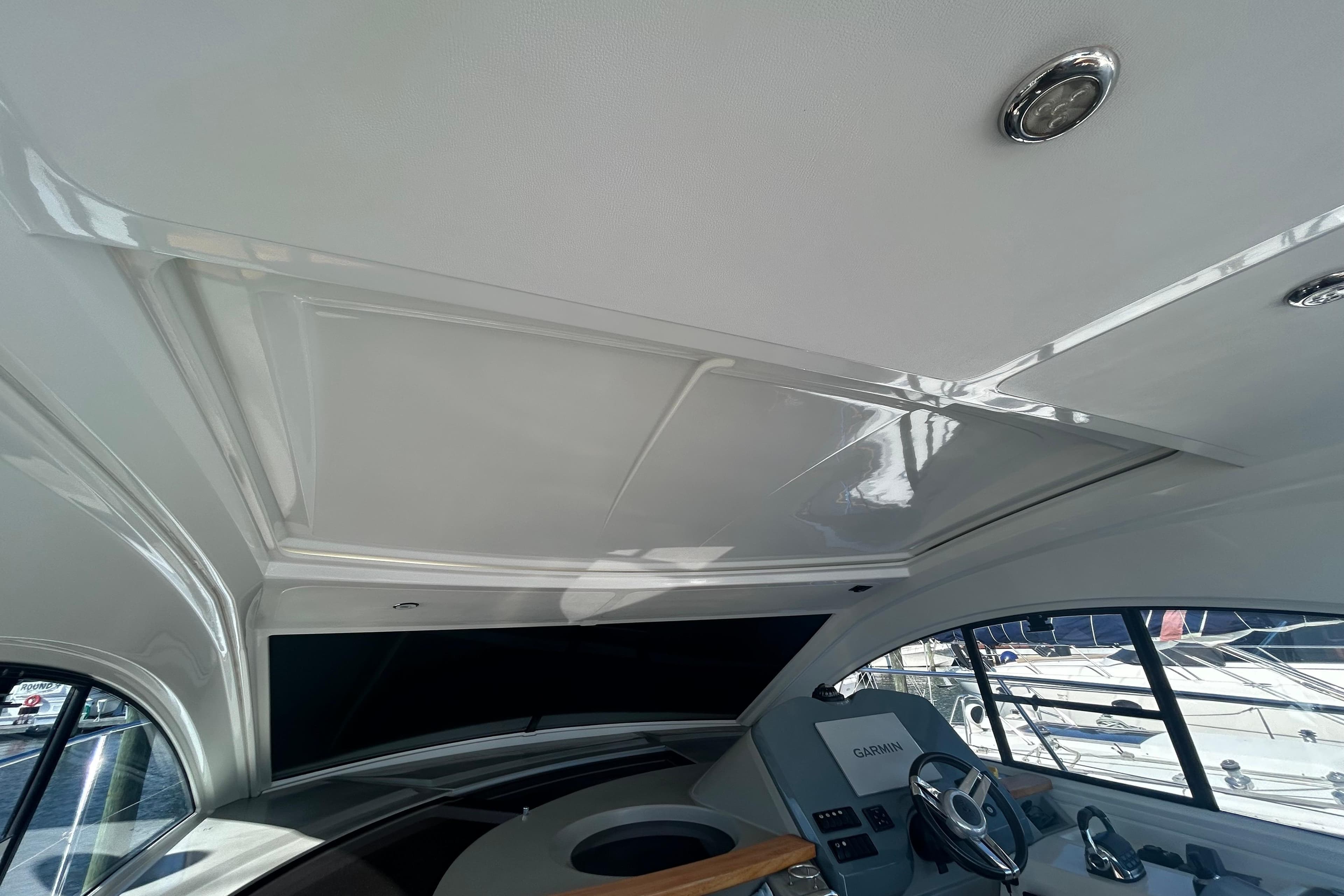 Interior view of 2012 Beneteau Gran Turismo 44 yacht helm with Garmin navigation system.
