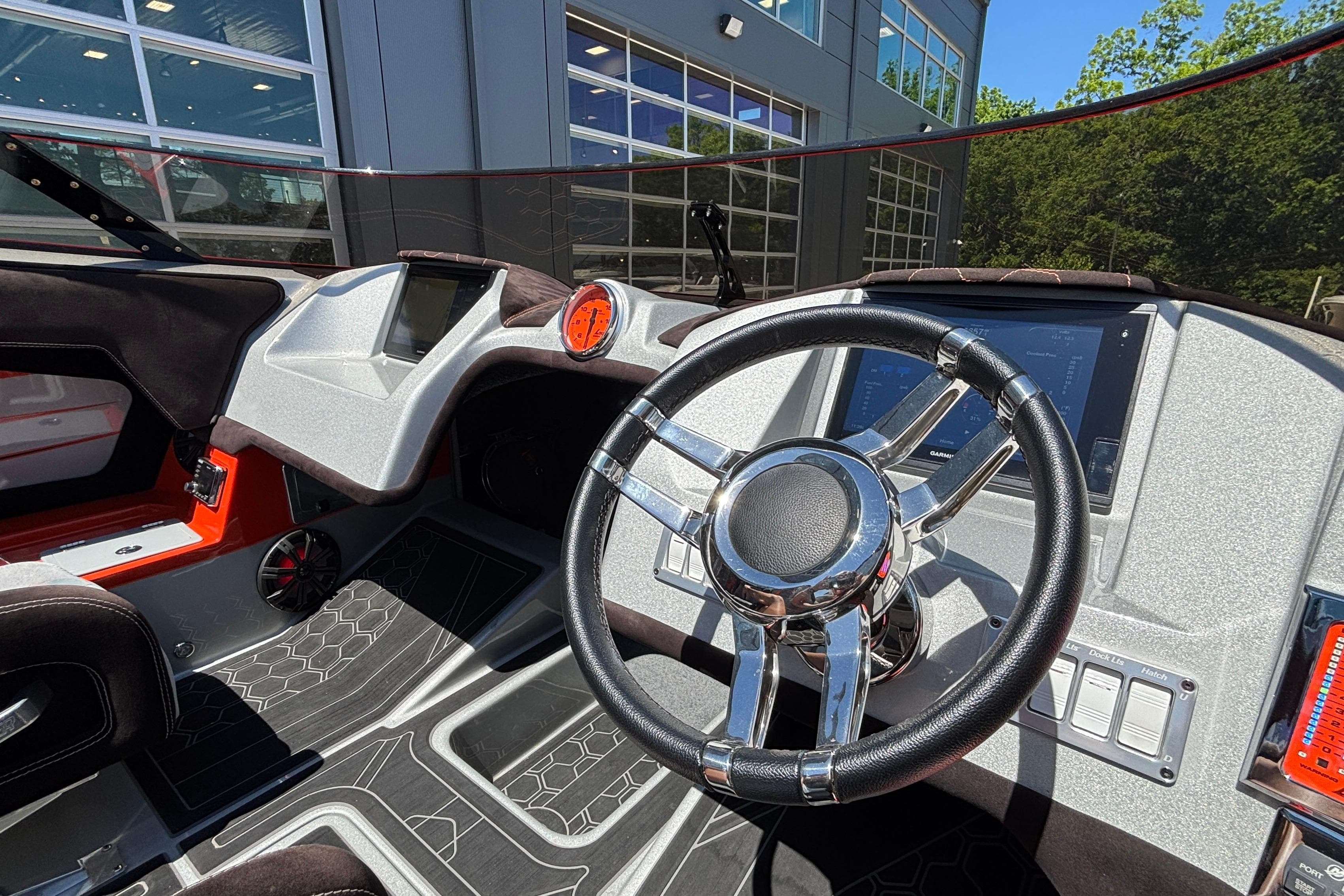 Interior of a 2020 Eliminator 36 Daytona Coupe, featuring a sleek steering wheel and modern dashboard.