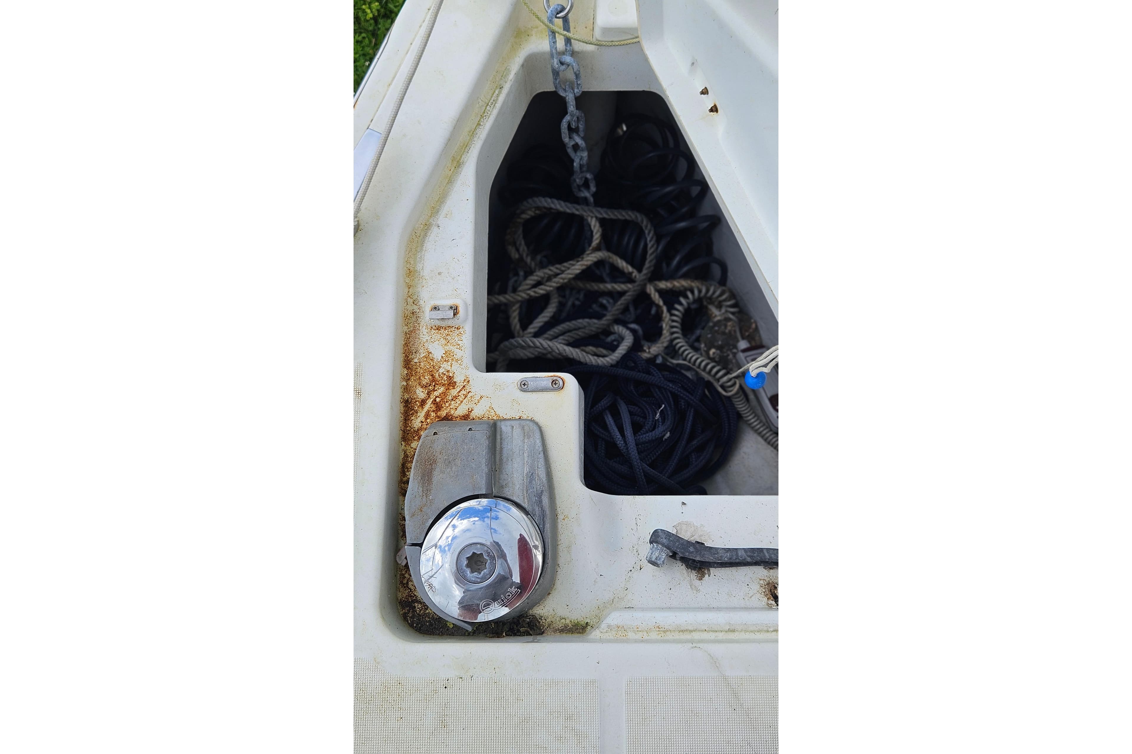 Anchor locker of 2010 Beneteau Oceanis 34 GT with ropes and chain.