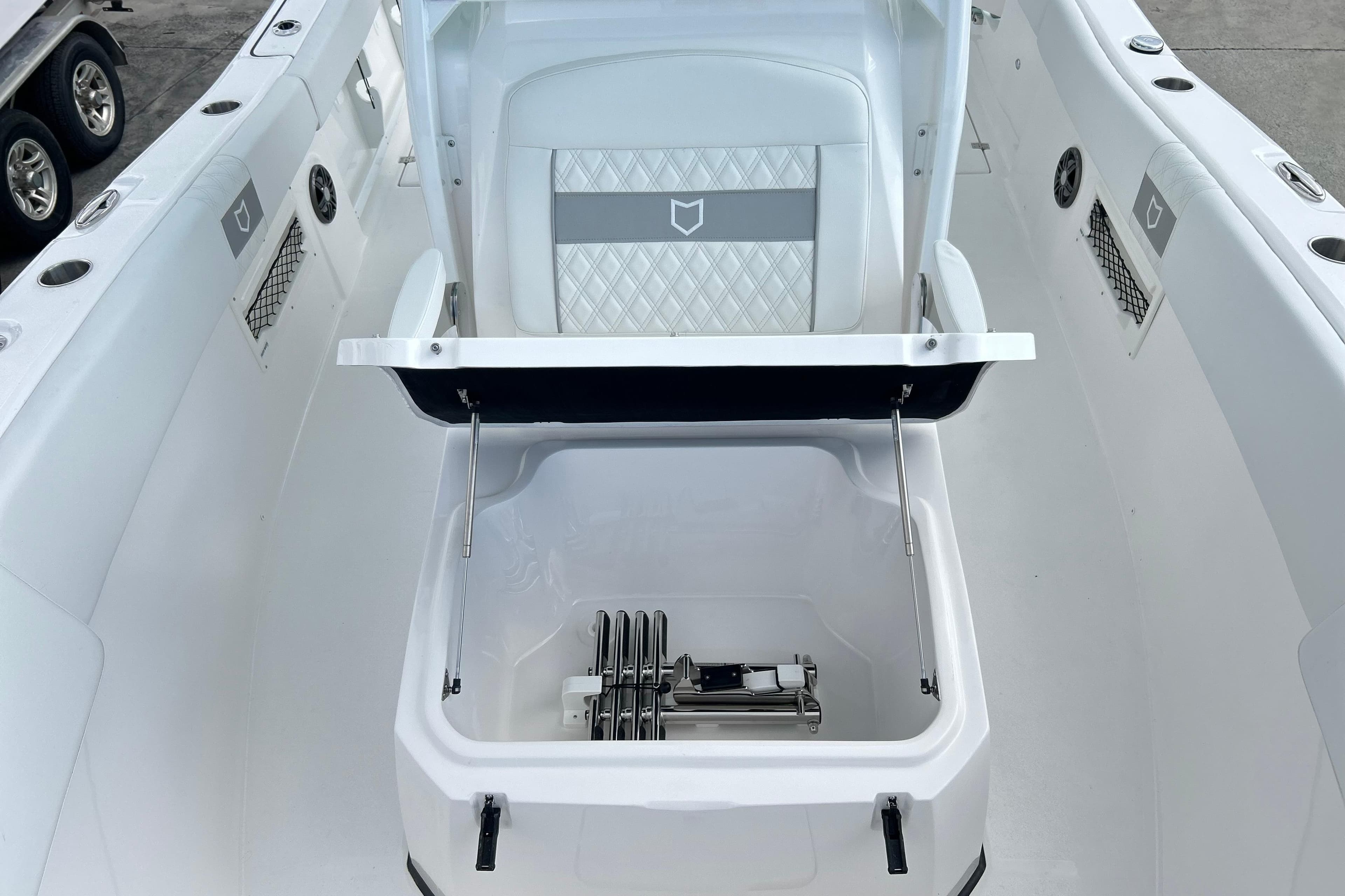 2026 Sea Fox 268 Commander boat interior with open storage compartment and seating.