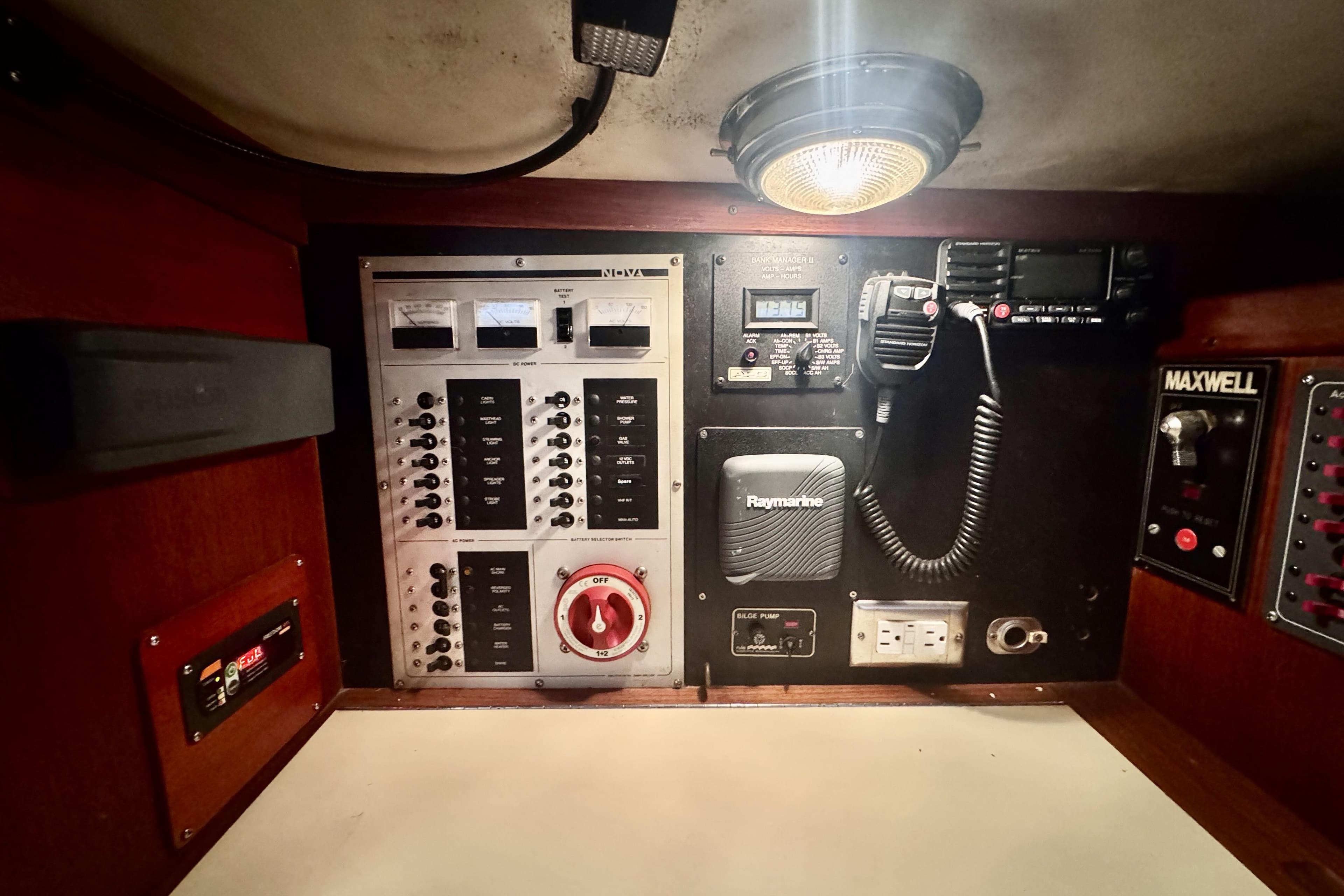 Control panel of a 1991 Freedom 38 sailboat with various switches and gauges.