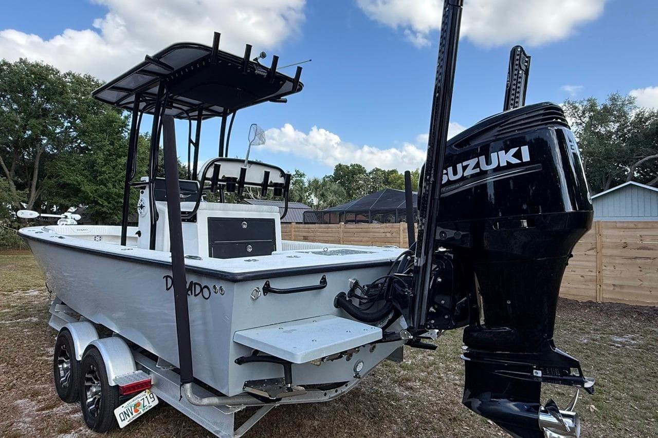 2017 Dorado 25 SE boat with Suzuki outboard motor on trailer.