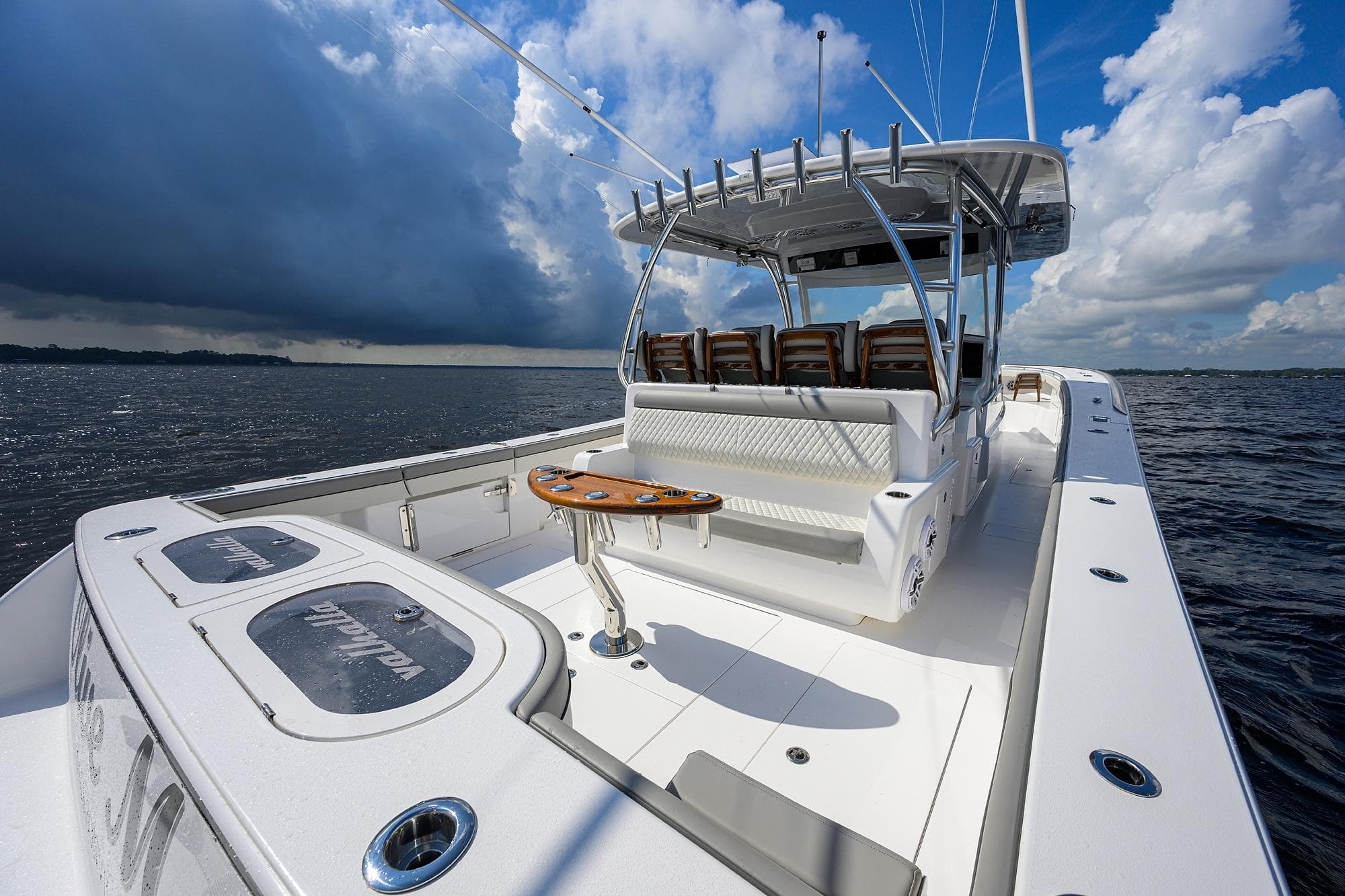 Valhalla V-46 2026 boat on open water under dramatic cloudy sky.