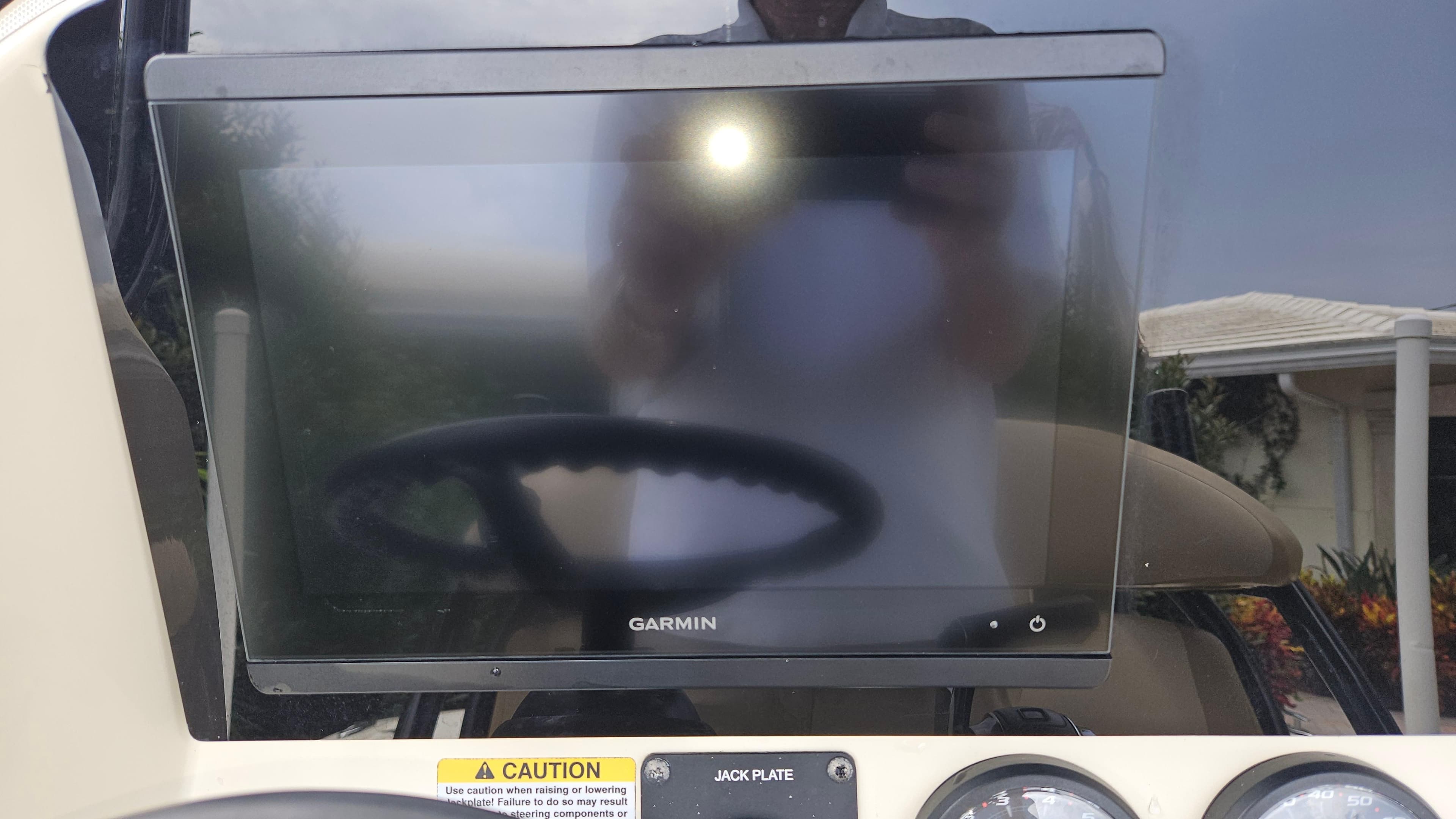 Garmin display on 2021 Scout 231 XS boat dashboard with caution label visible.