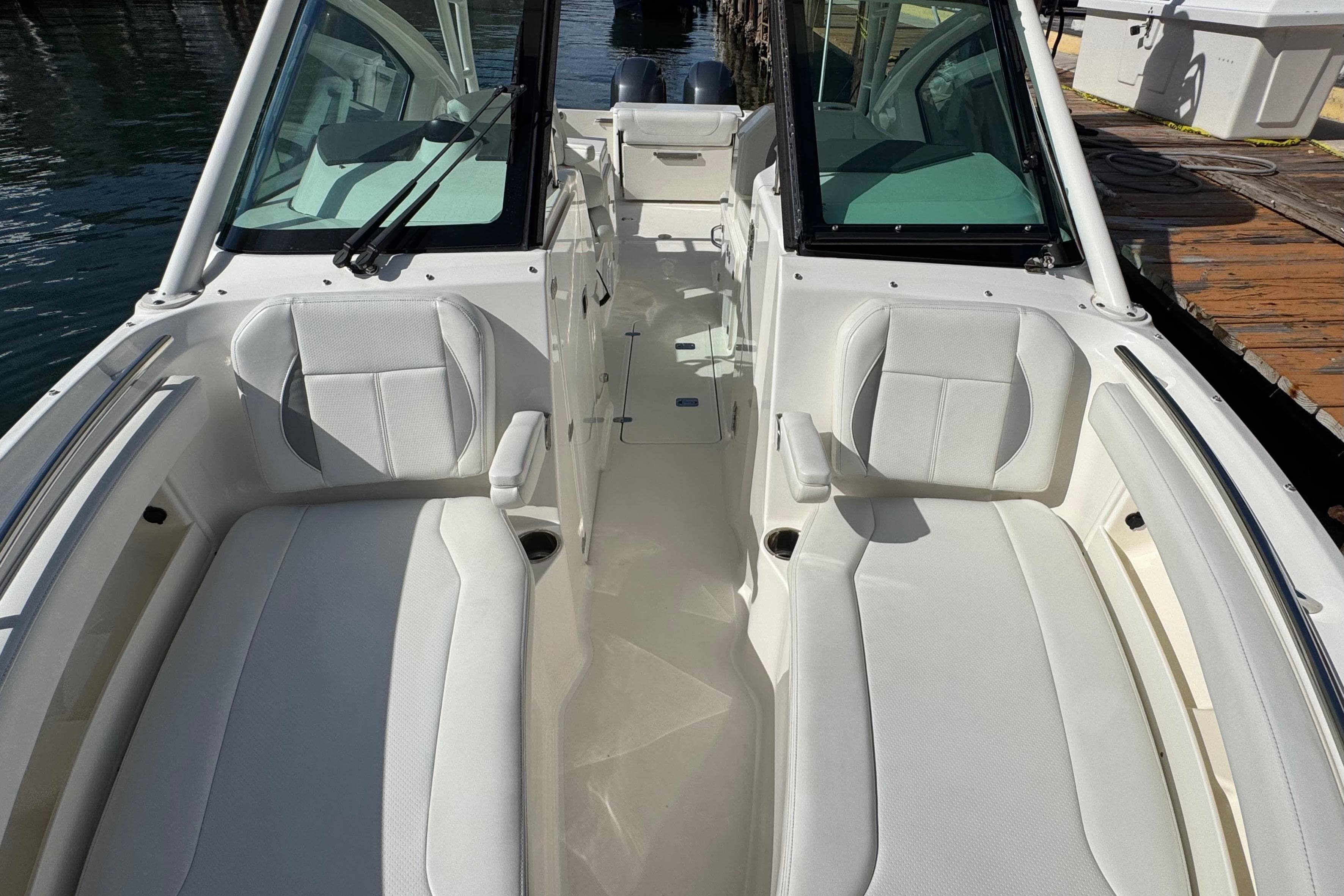 2022 Pursuit DC 266 Dual Console boat interior with white seating and open deck.