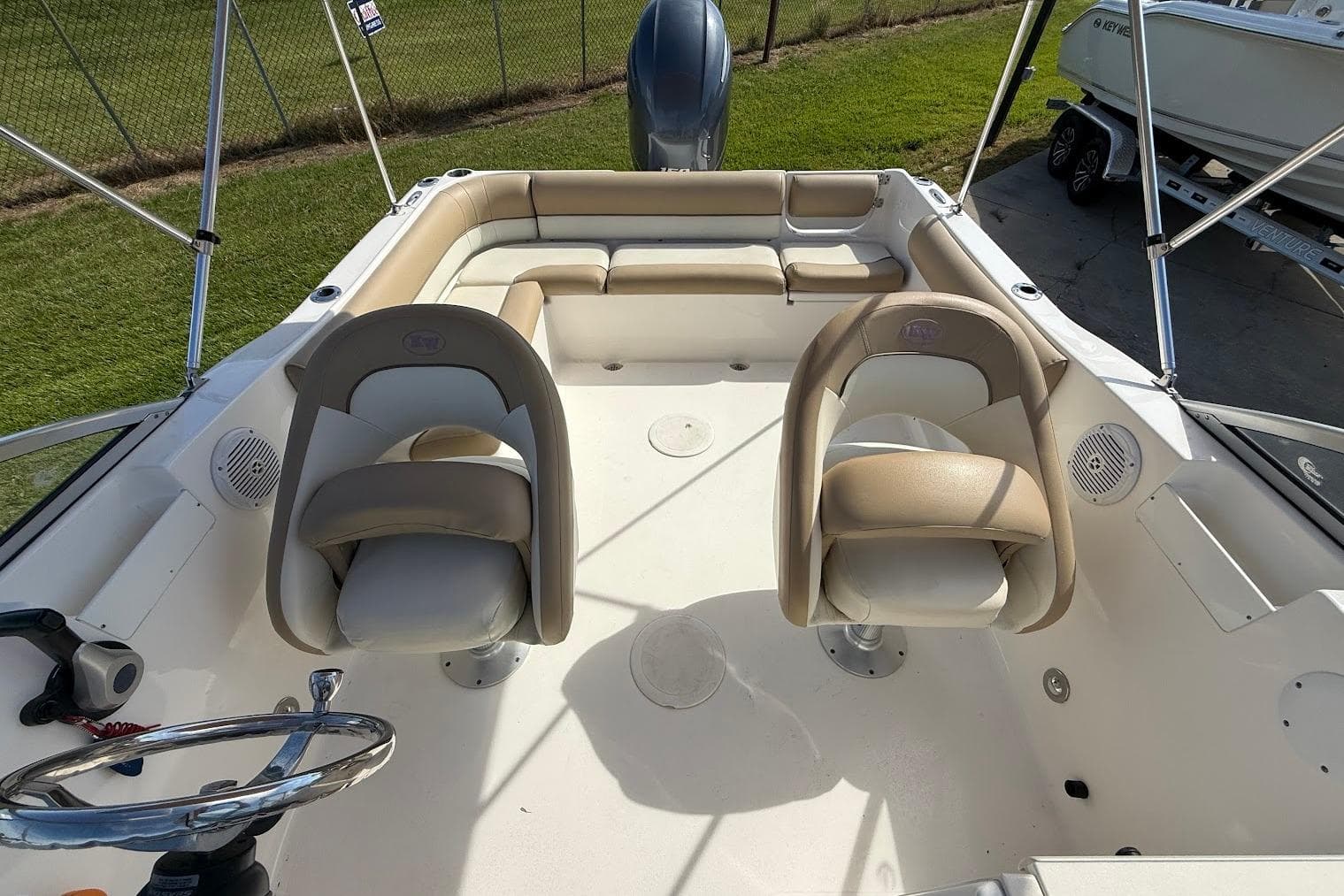 2019 Key West 203 DFS boat interior with seating and steering wheel.