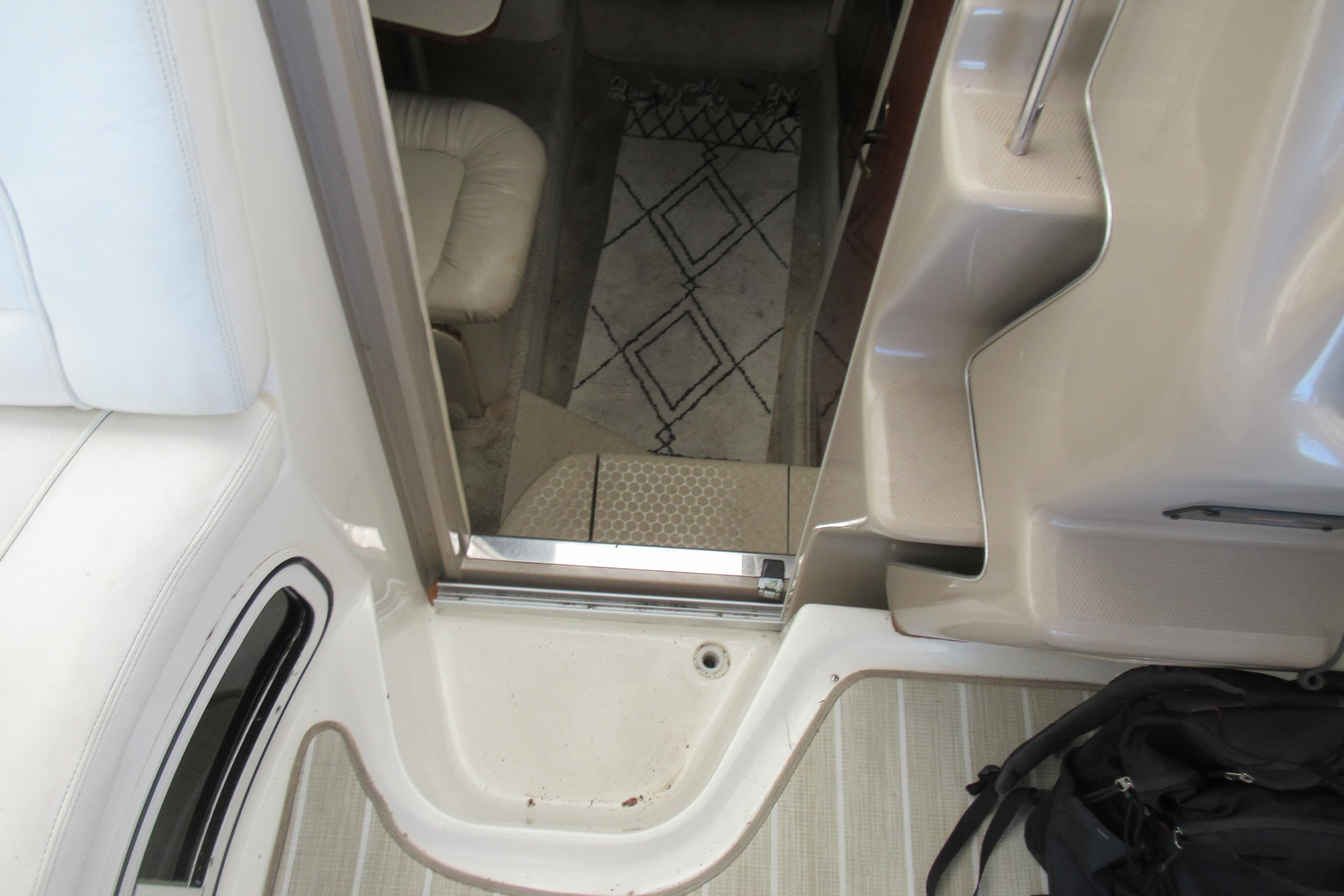 Interior view of 2001 Searay 280 Sundancer boat, showing cabin entrance and seating area.