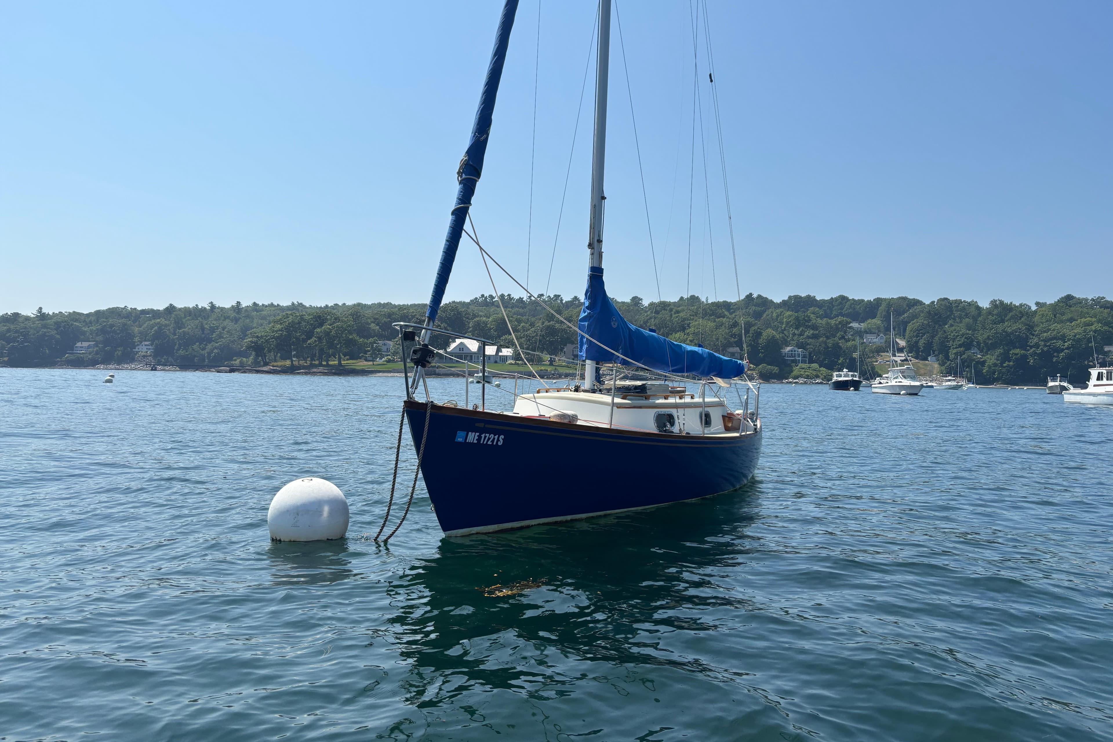 Sailboat "Hank Hinckley Great Harbor 26" from 1998 moored on calm water.