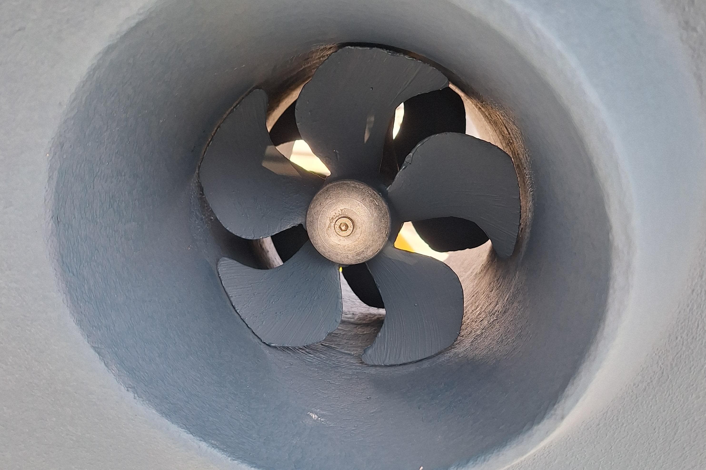 Close-up of a 1996 Island Packet 40 boat propeller in a tunnel.