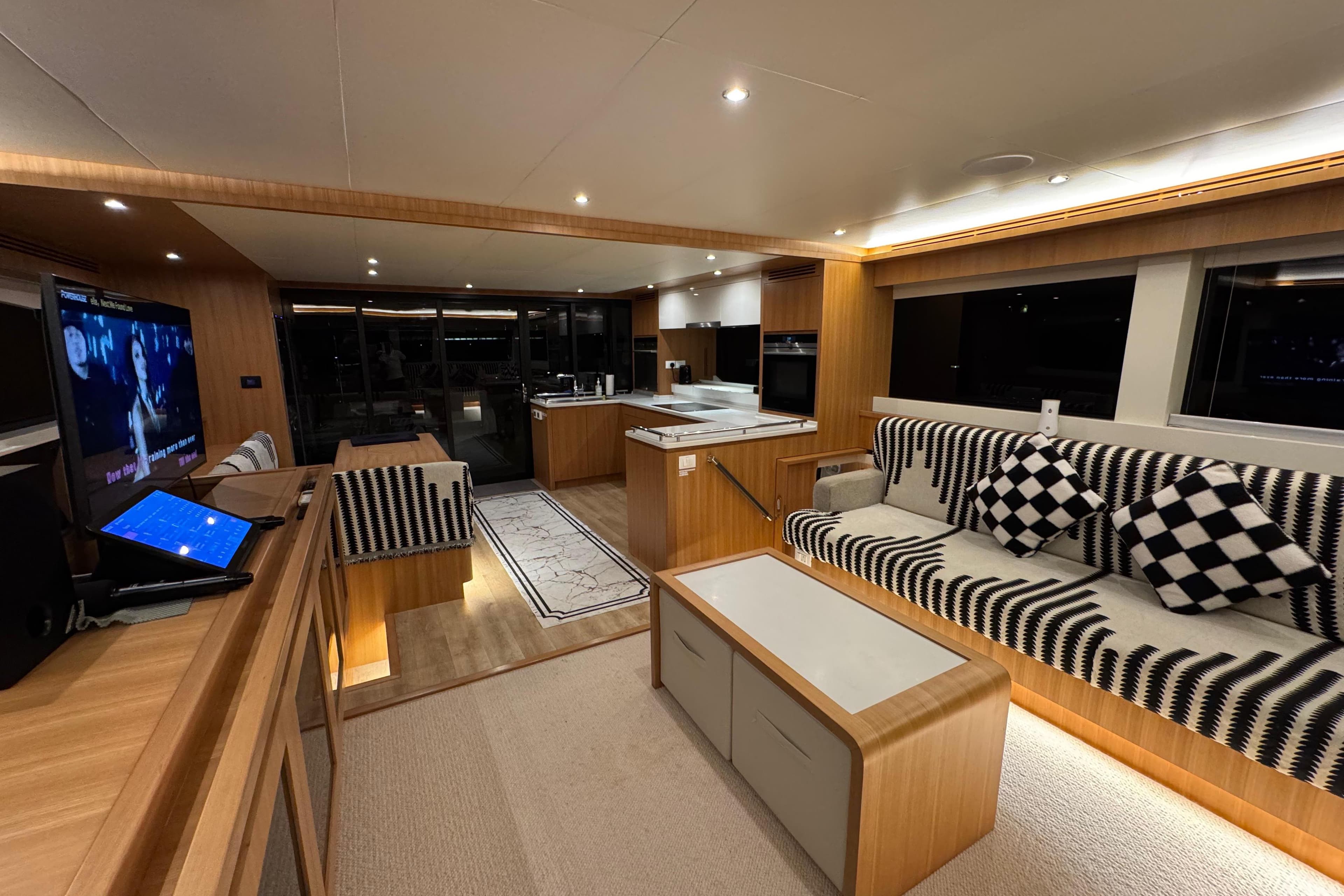 Luxurious interior of 2022 ILIAD 50 yacht with modern furnishings and ambient lighting.