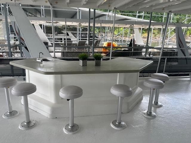 Houseboat bar area with stools, Thoroughbred model, 2007, docked at marina.