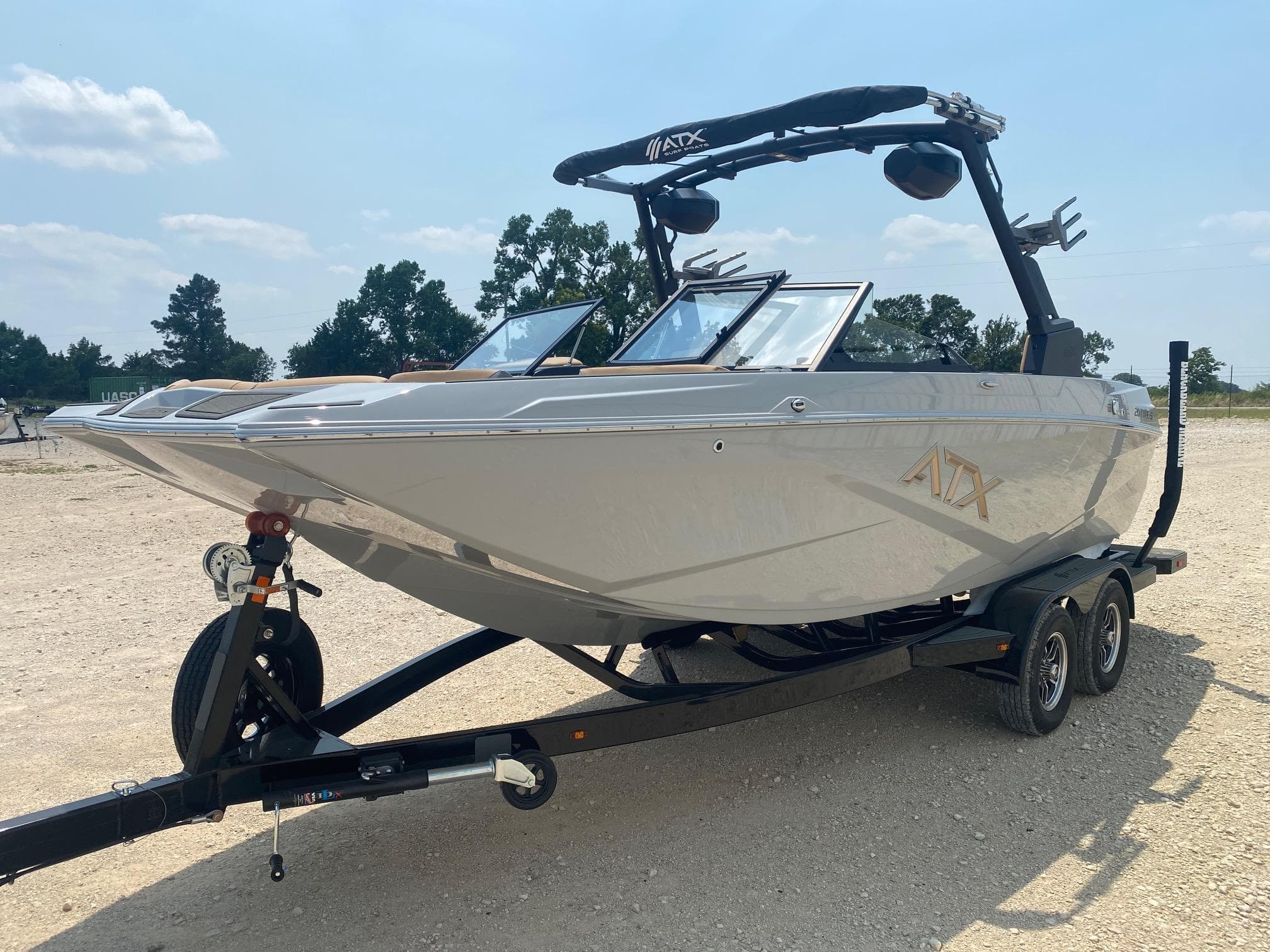 2026 ATX Surf Boats 20 Type-S on trailer, parked outdoors under clear sky.