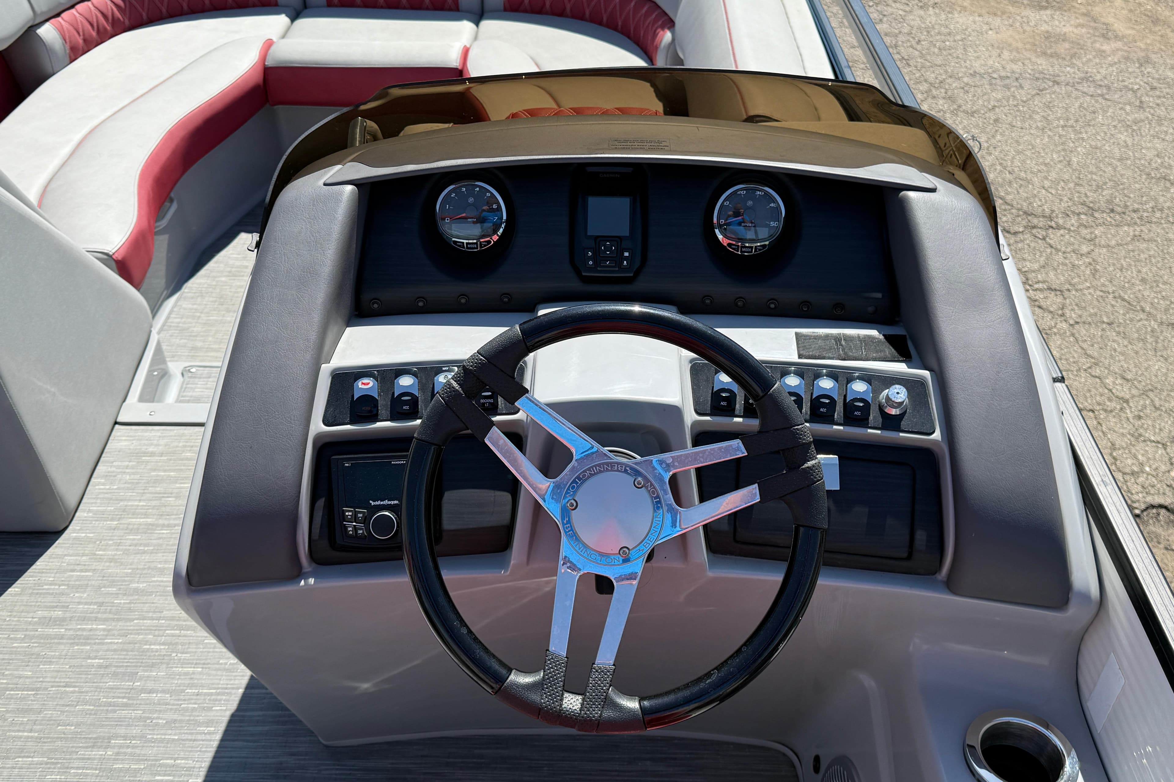2022 Bennington R 24 Quad Bench Bowrider dashboard with steering wheel and controls.