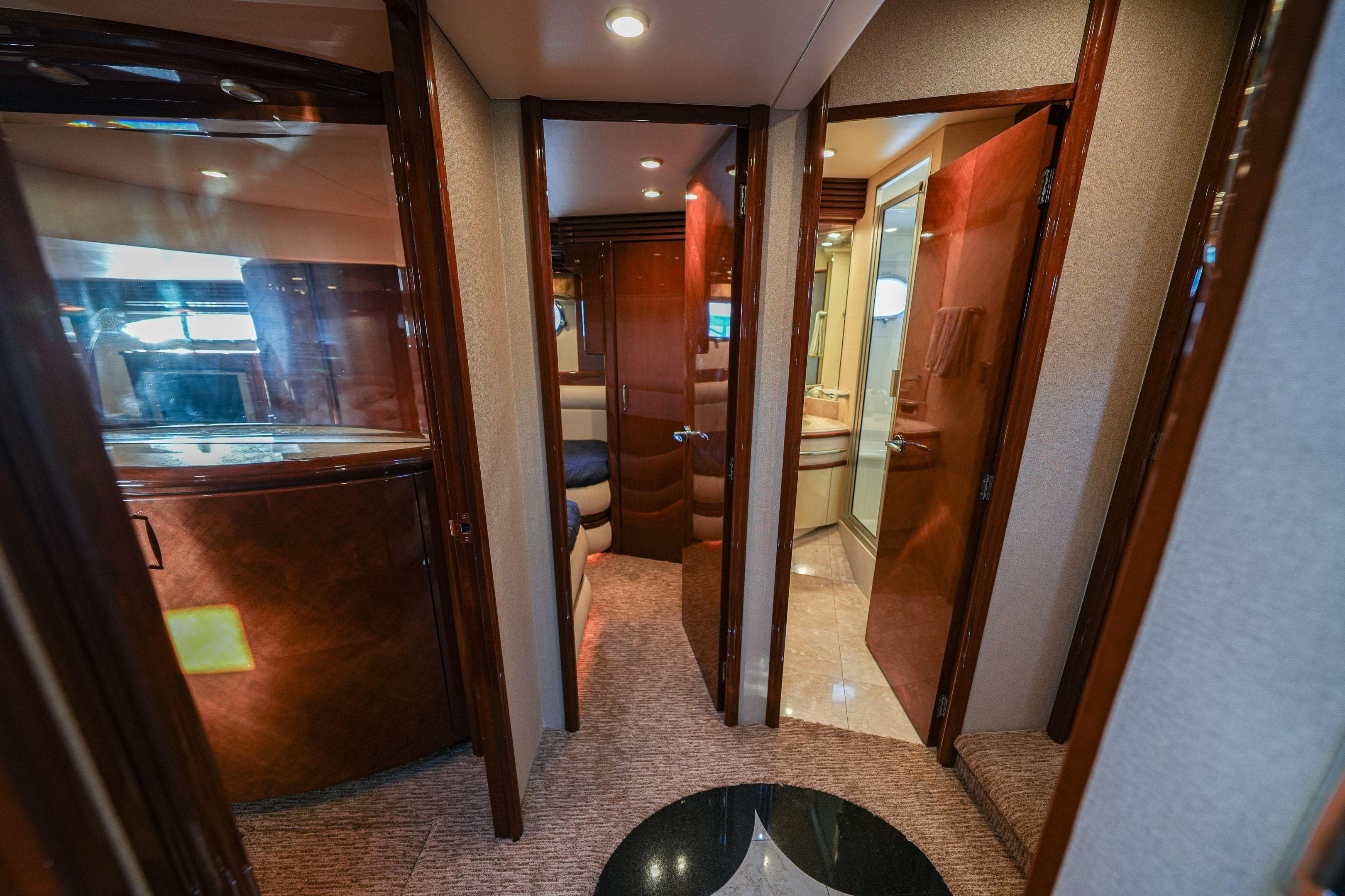 Luxurious interior of a 2006 Marquis 65 yacht, featuring elegant wood finishes and modern design.
