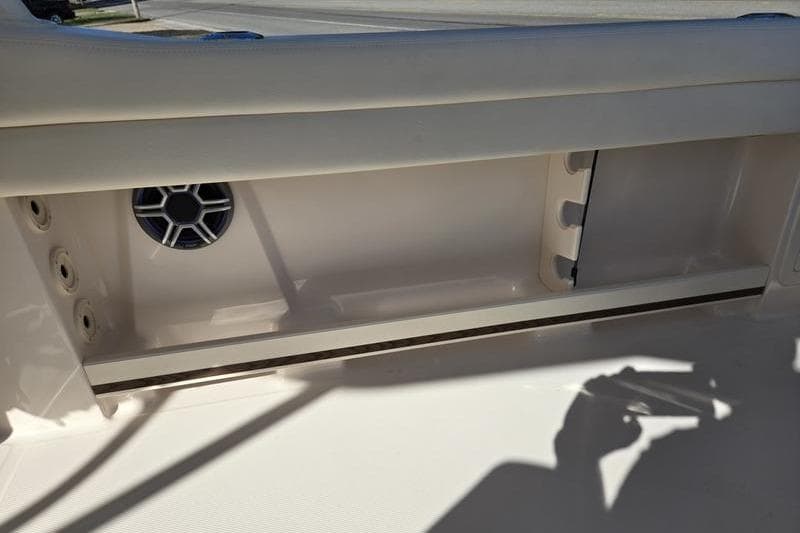 2026 Grady-White Freedom 235 boat interior with speaker and storage compartment.