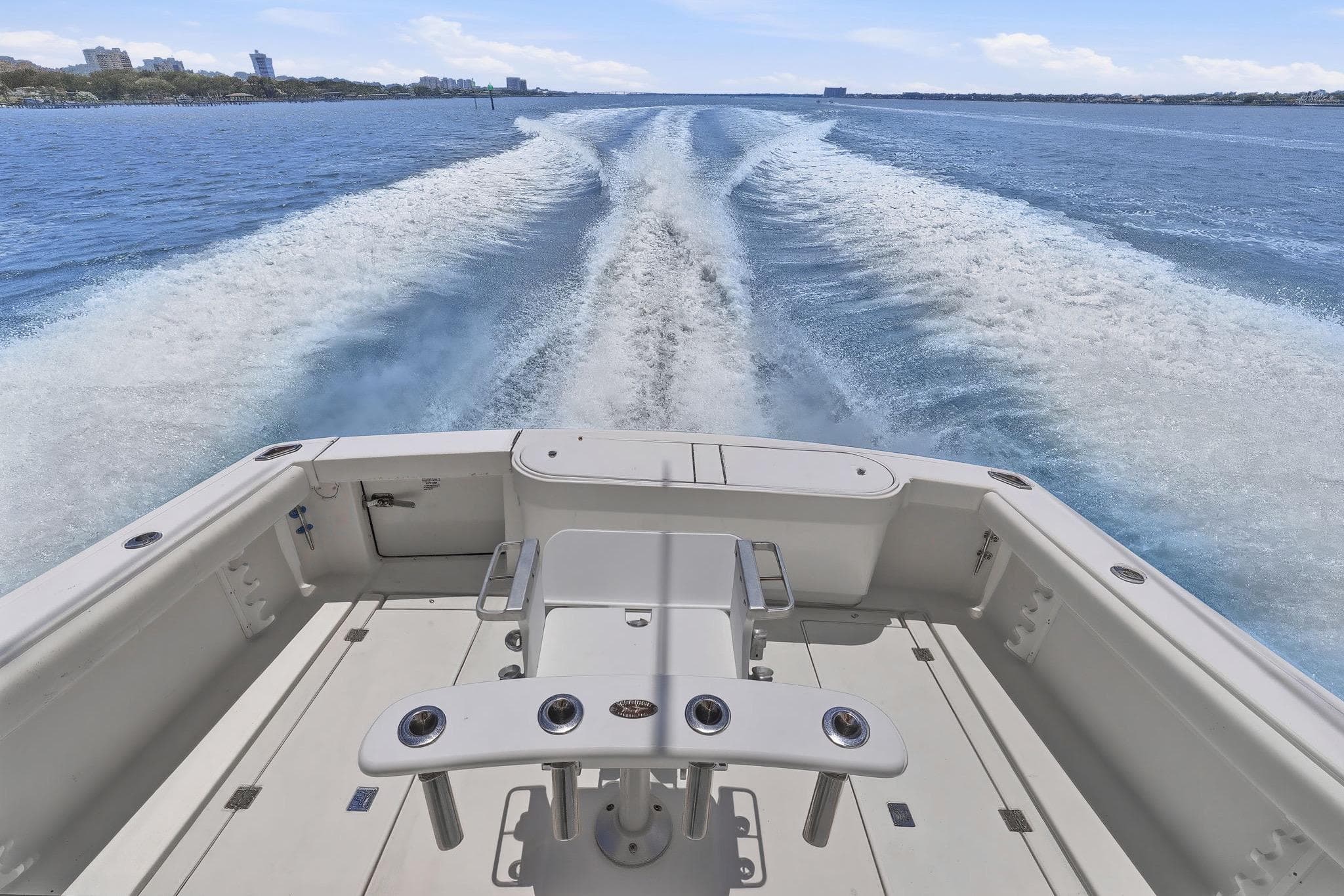 2005 Rampage 38 Express boat cruising on open water, leaving a wake behind.