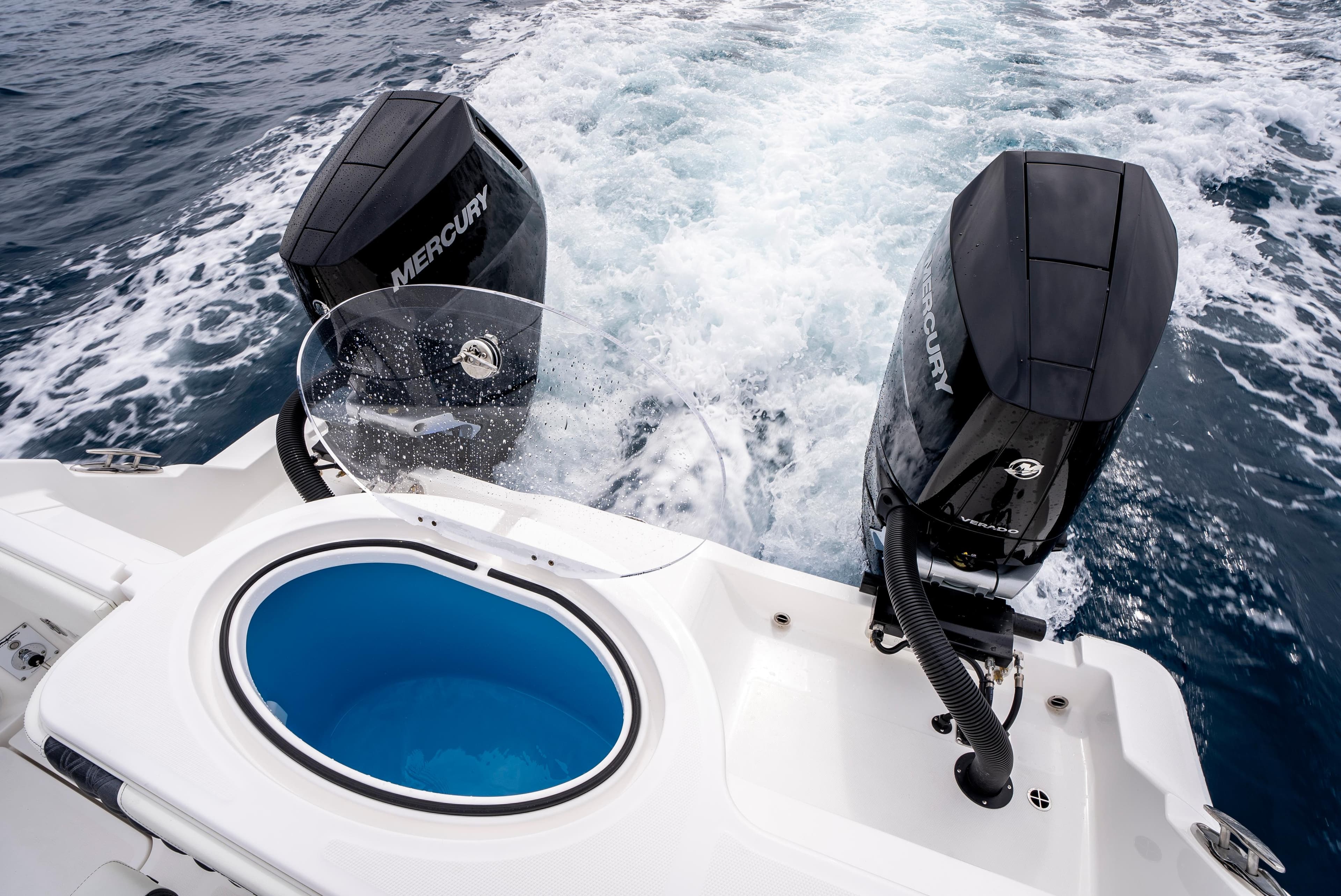 2024 Invincible 33 boat with dual Mercury engines on open water.