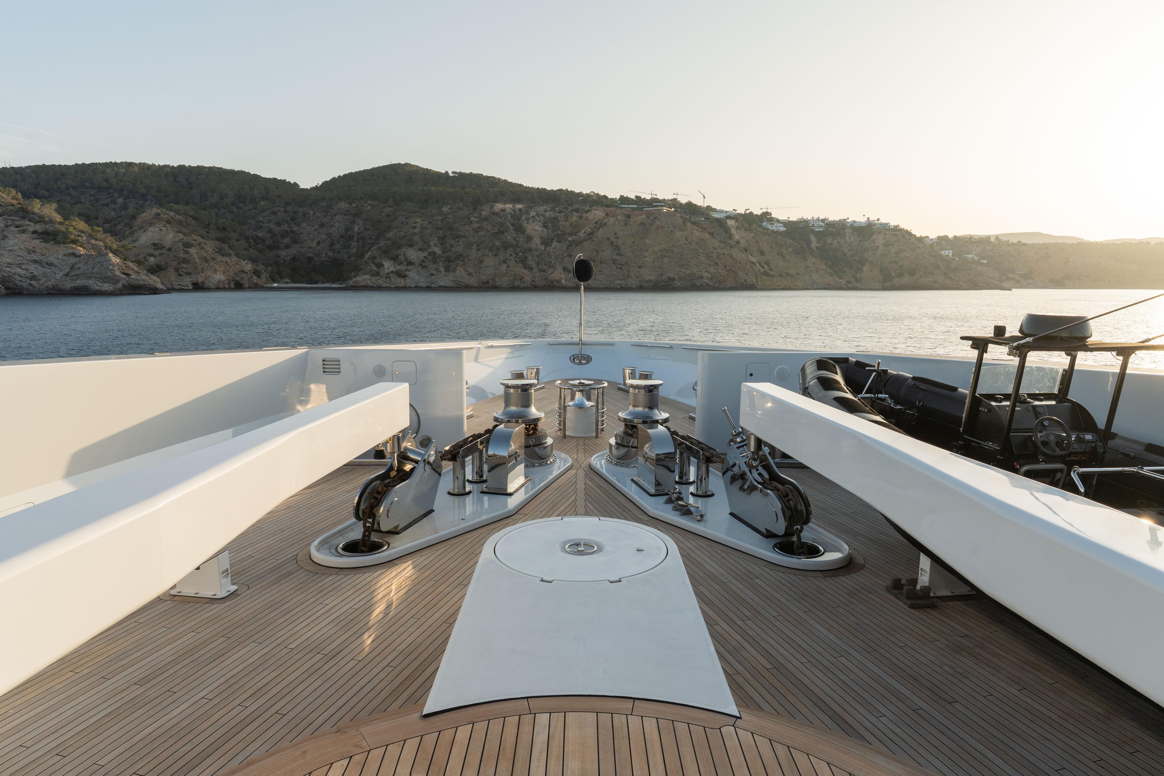 Deck of a 2015 Kusch Yacht overlooking the coastline.