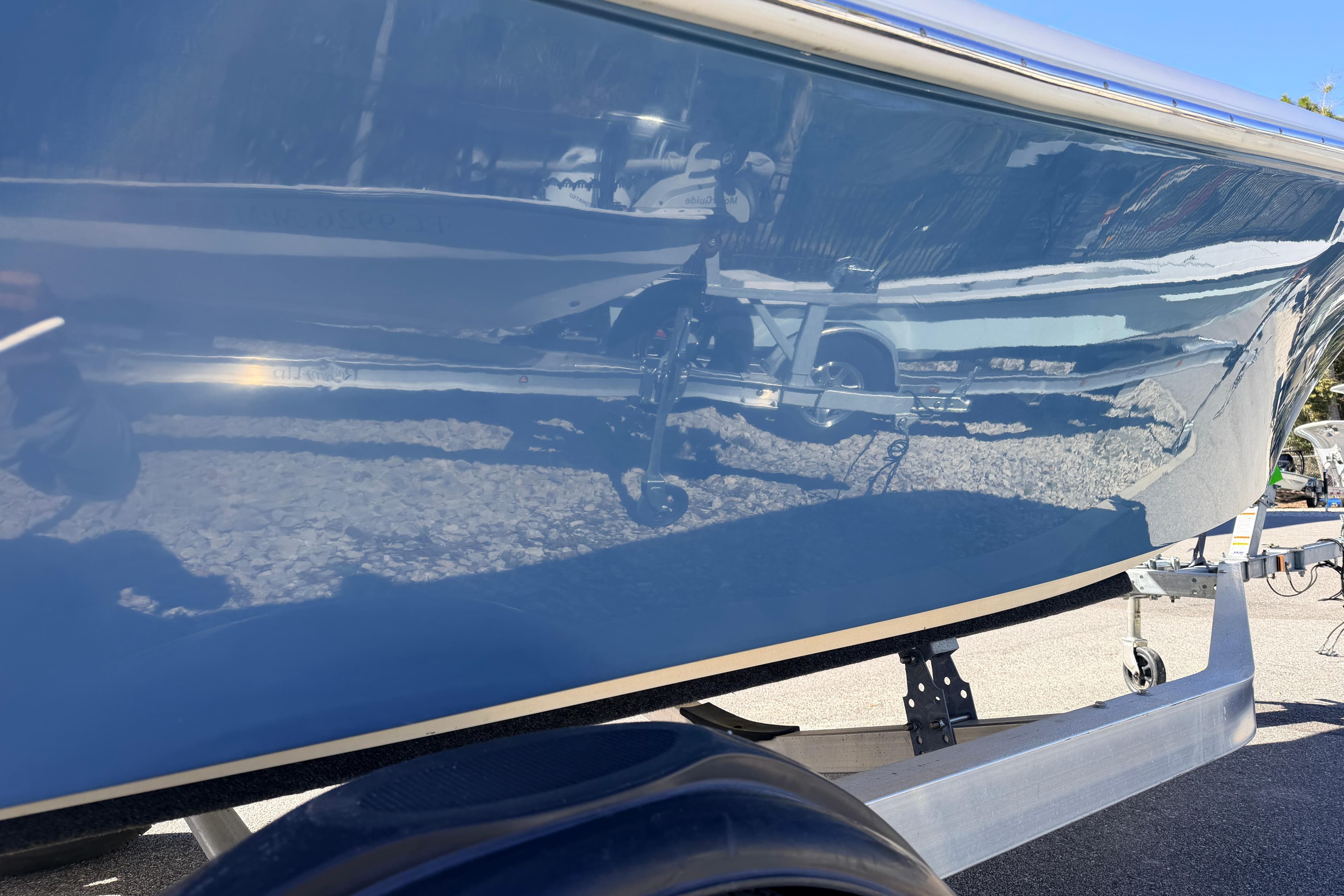 2015 Pioneer 186 Cape Island boat on trailer, reflecting surroundings.