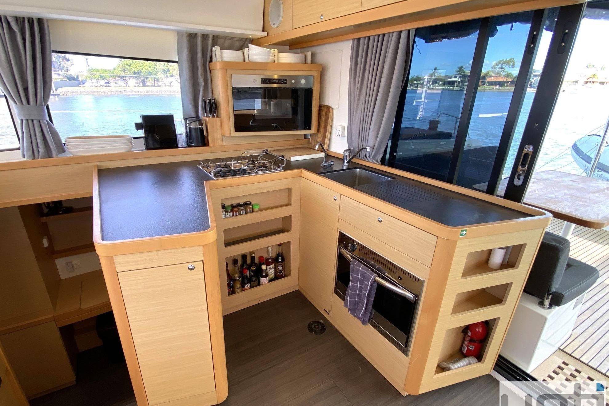 Modern kitchen interior of 2017 Lagoon 42 catamaran with sleek design and ample storage.