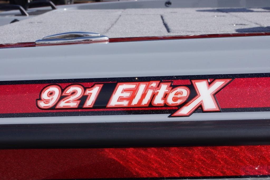 Phoenix 921 Elite X 2026 model logo on a sleek red surface.