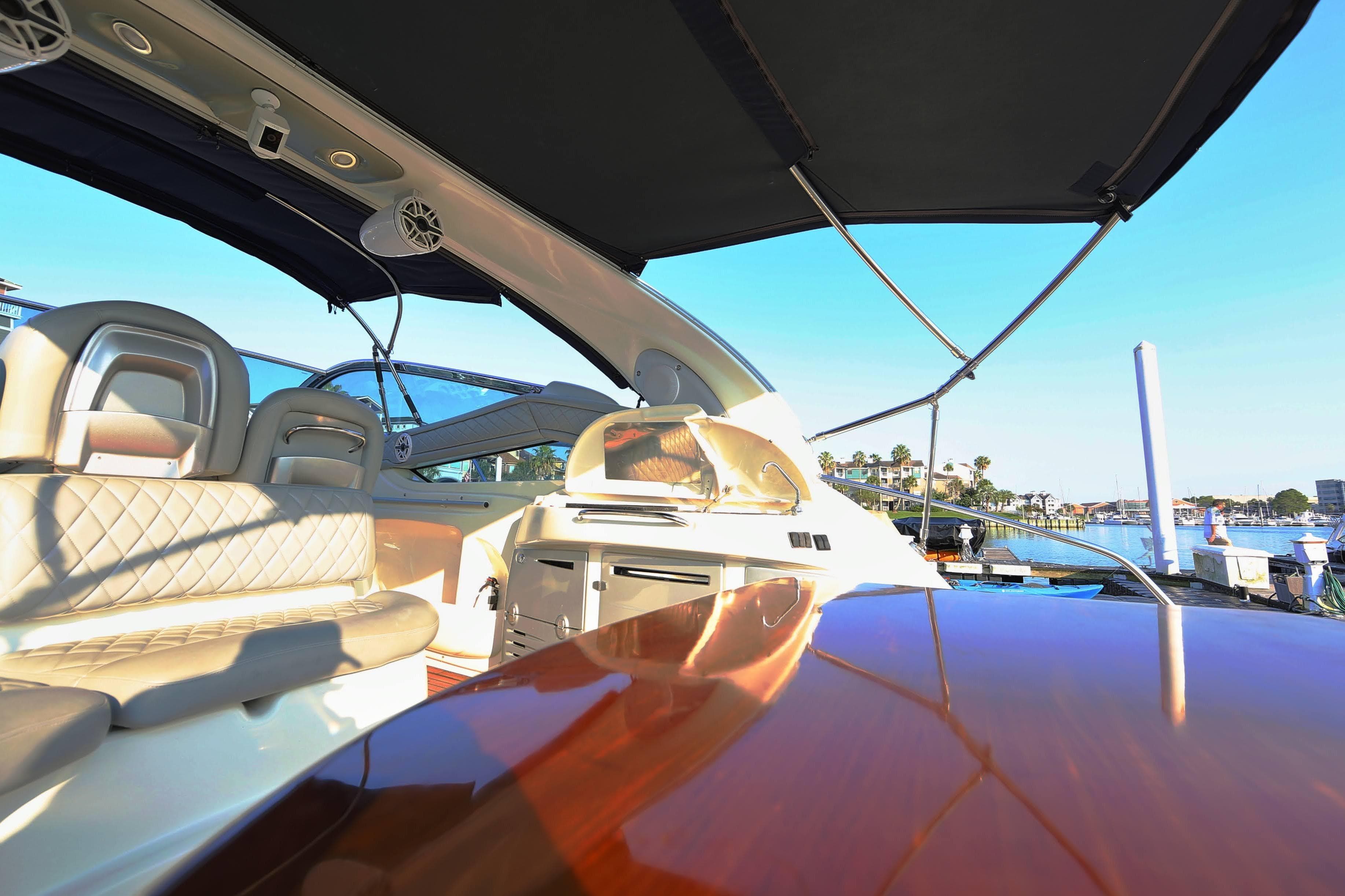 Luxurious 2008 Cranchi Mediterranee 43 yacht interior with elegant seating and waterfront view.