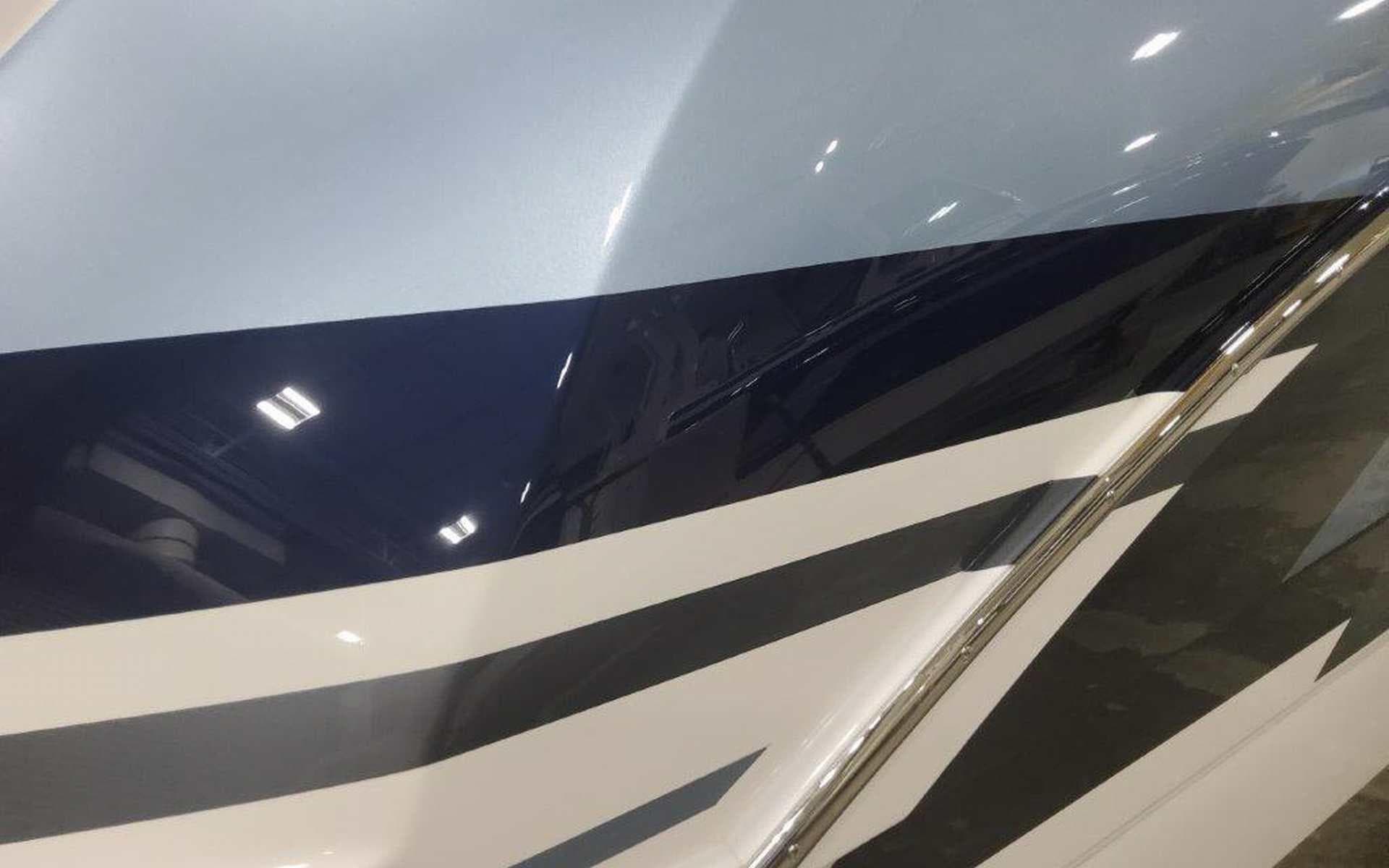 2025 Formula 330 Crossover Bowrider I/O with sleek, modern hull design and bold stripes.