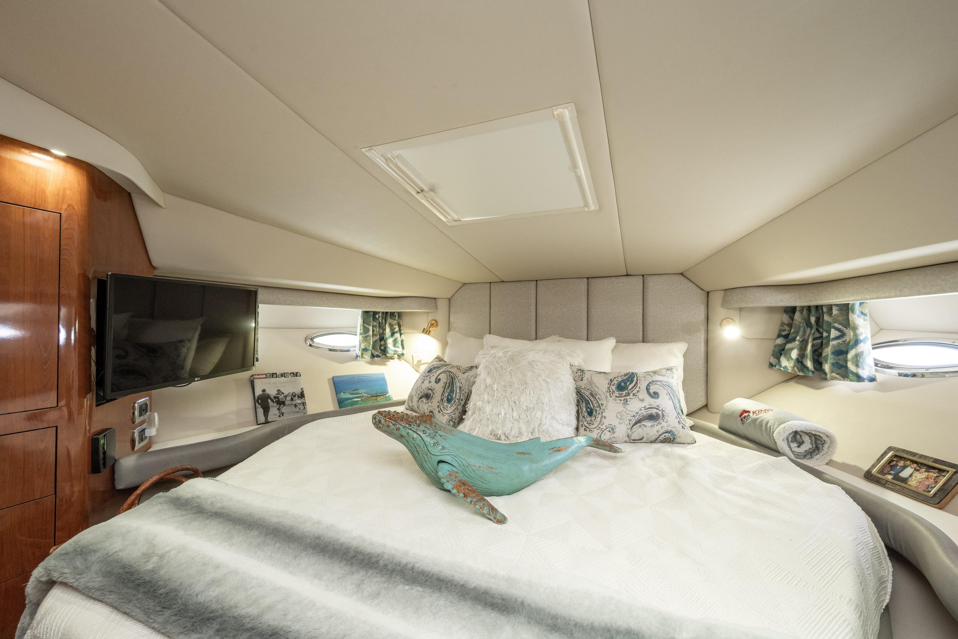 Luxurious 2003 Sea Ray 480 Motor Yacht bedroom with elegant decor and modern amenities.