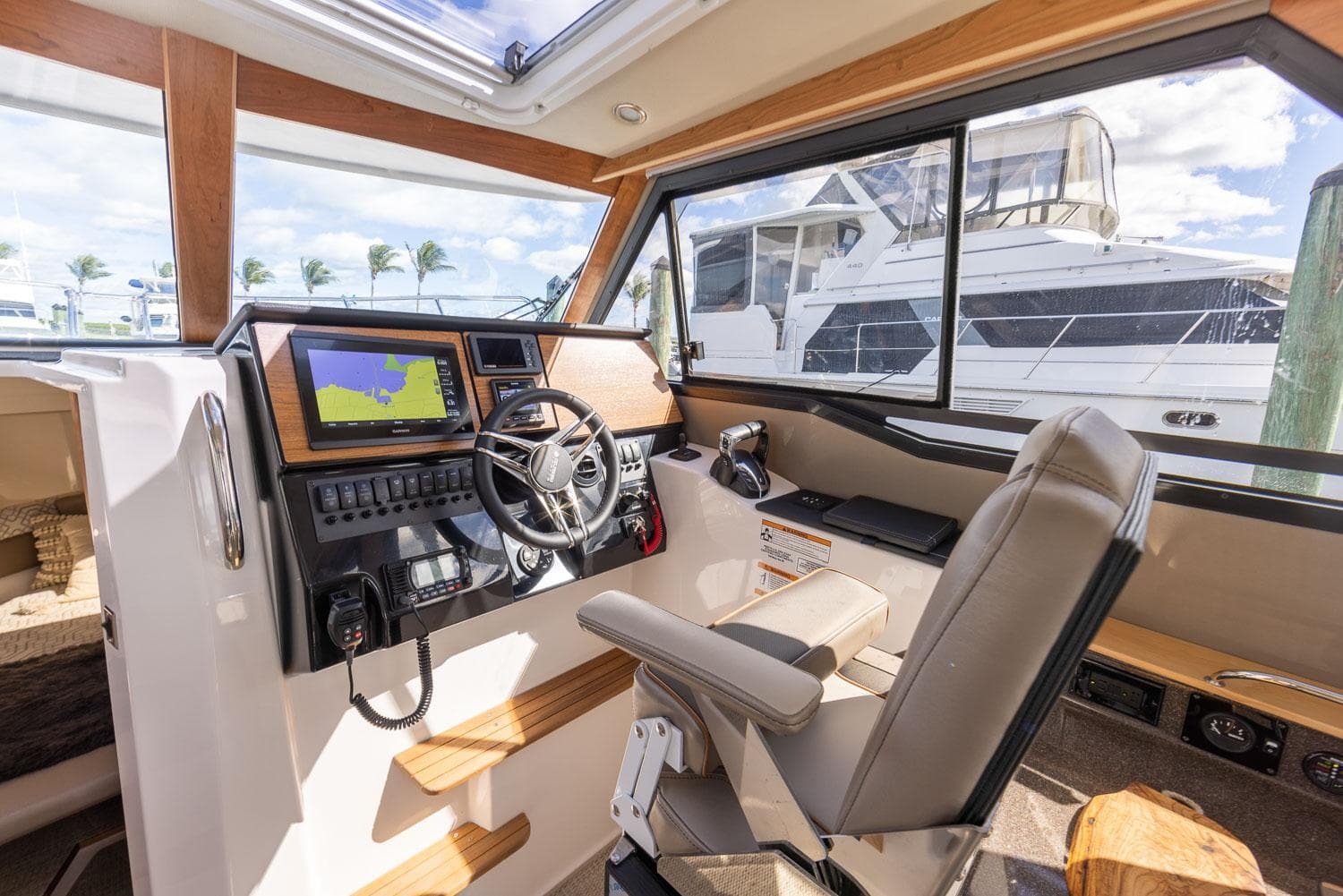 Interior of 2025 Cutwater C-288 Coupe LE boat with modern helm and navigation system.