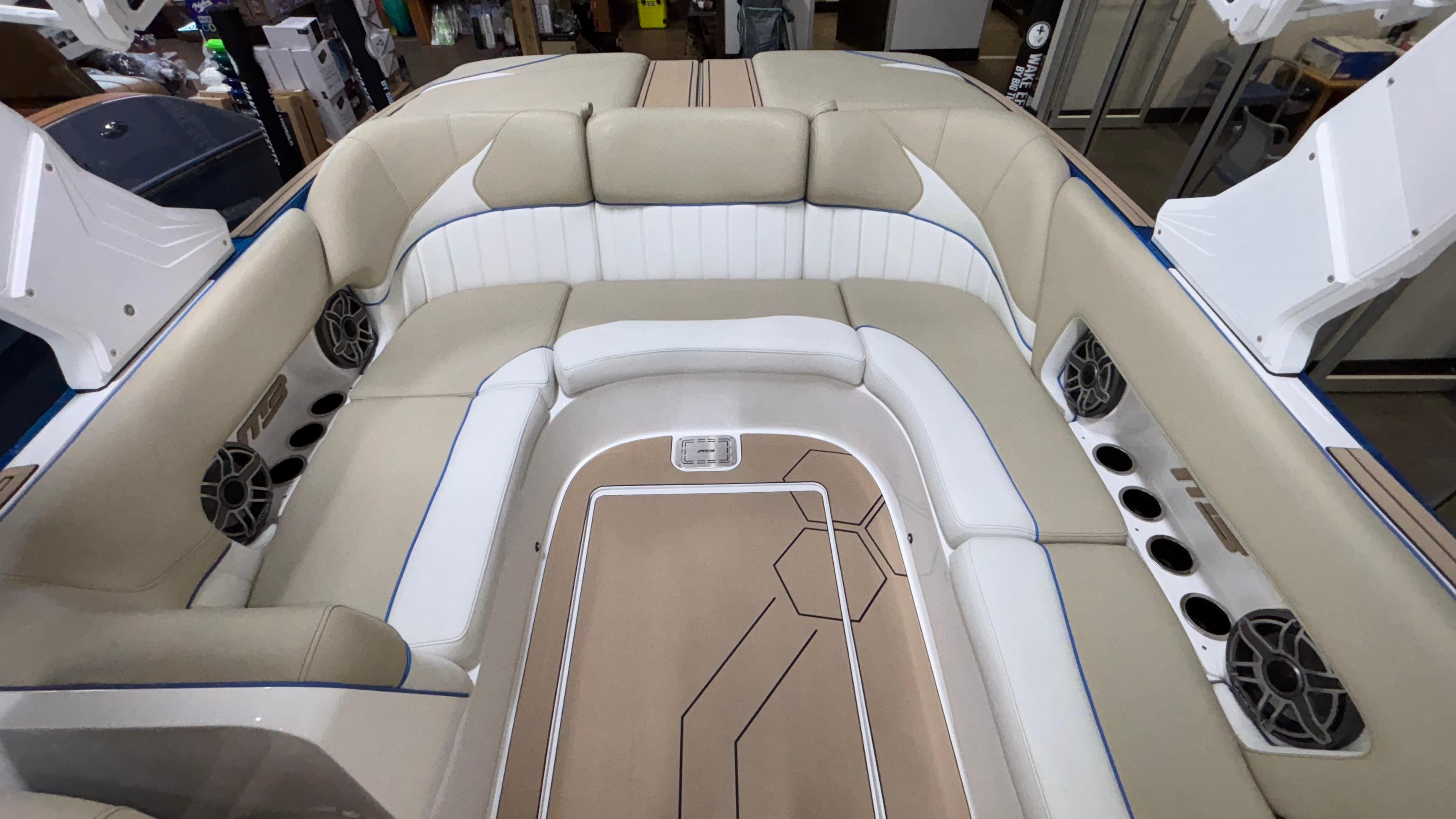 Luxurious interior of 2025 MB B52 23 Classic boat with beige and white seating.