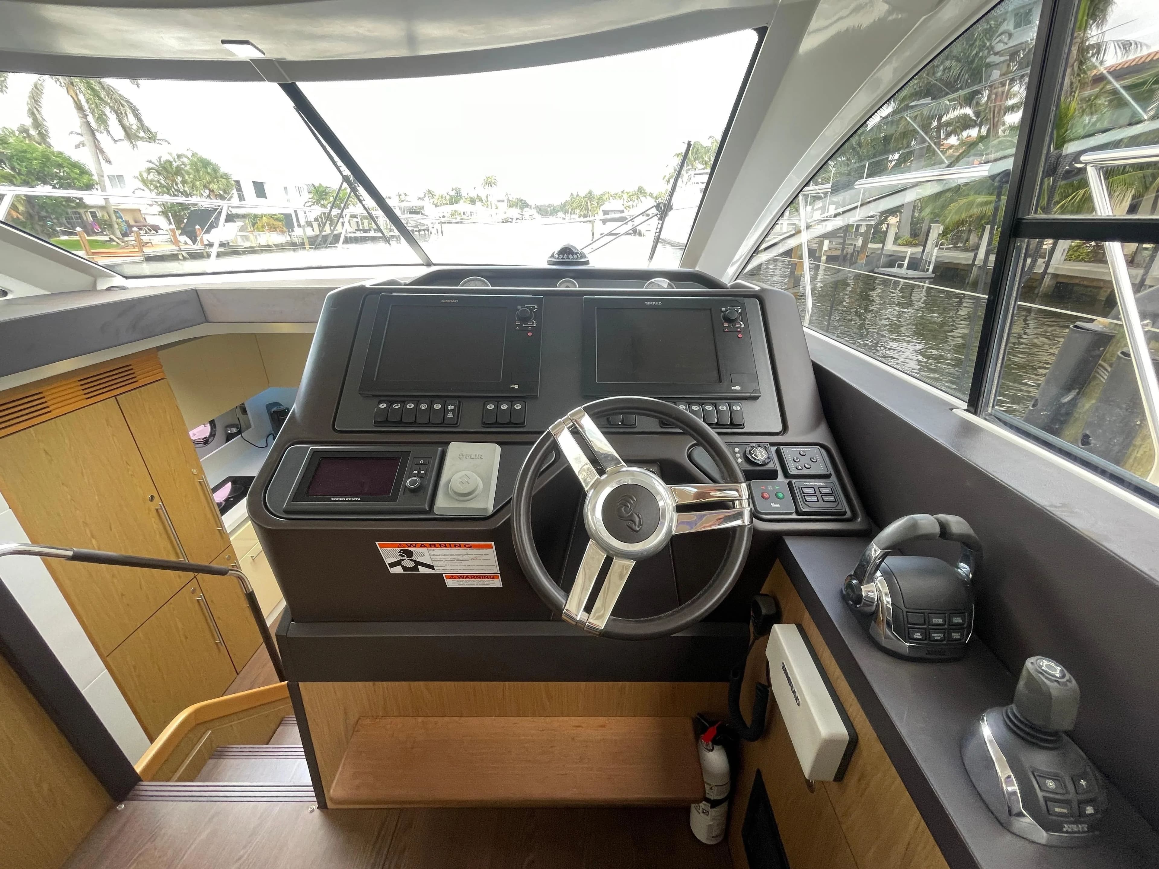 Interior view of the helm station on a 2014 Beneteau Gran Turismo 49 yacht.