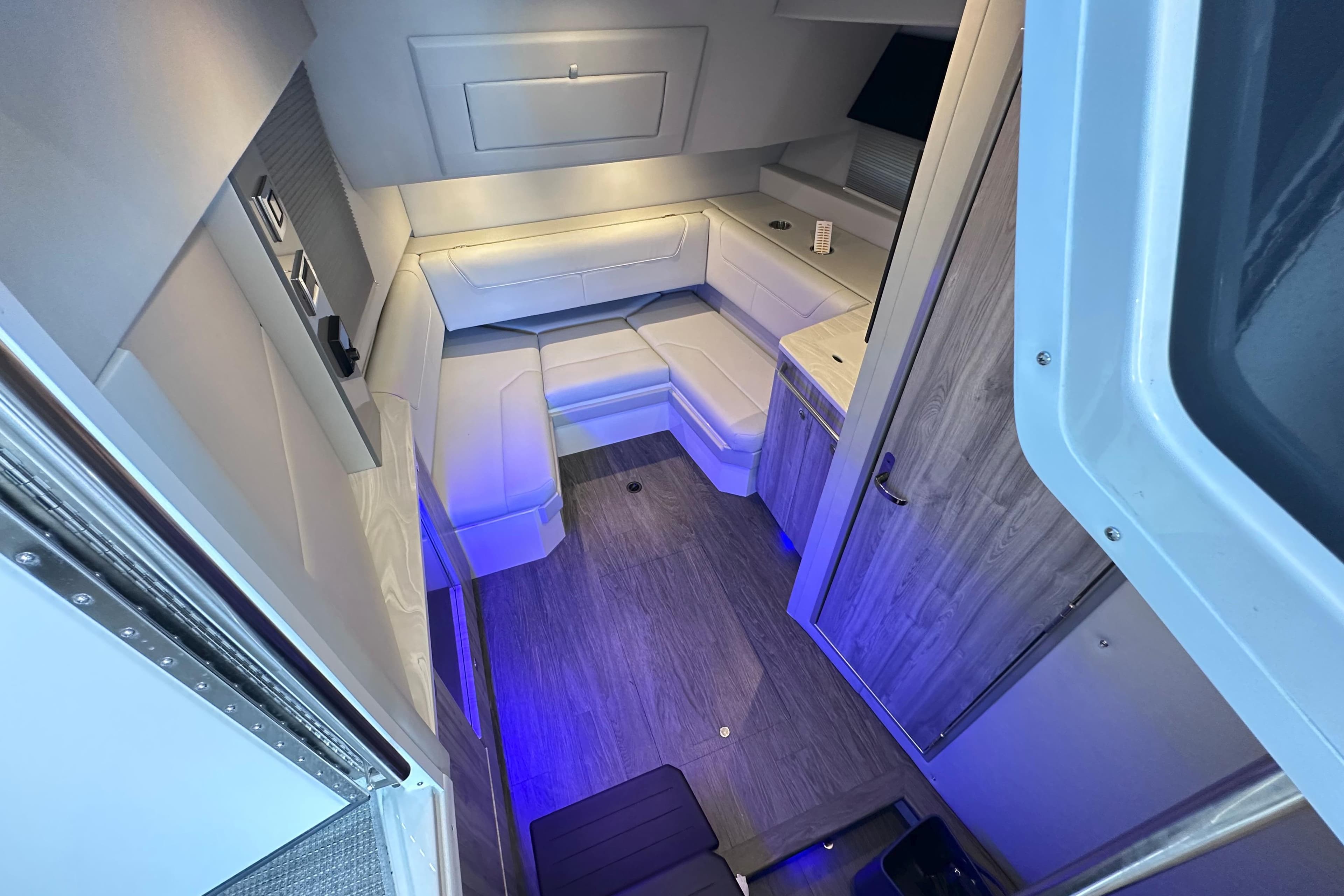 2023 Formula 380 Super Sport Crossover OB cabin interior with modern seating and ambient lighting.