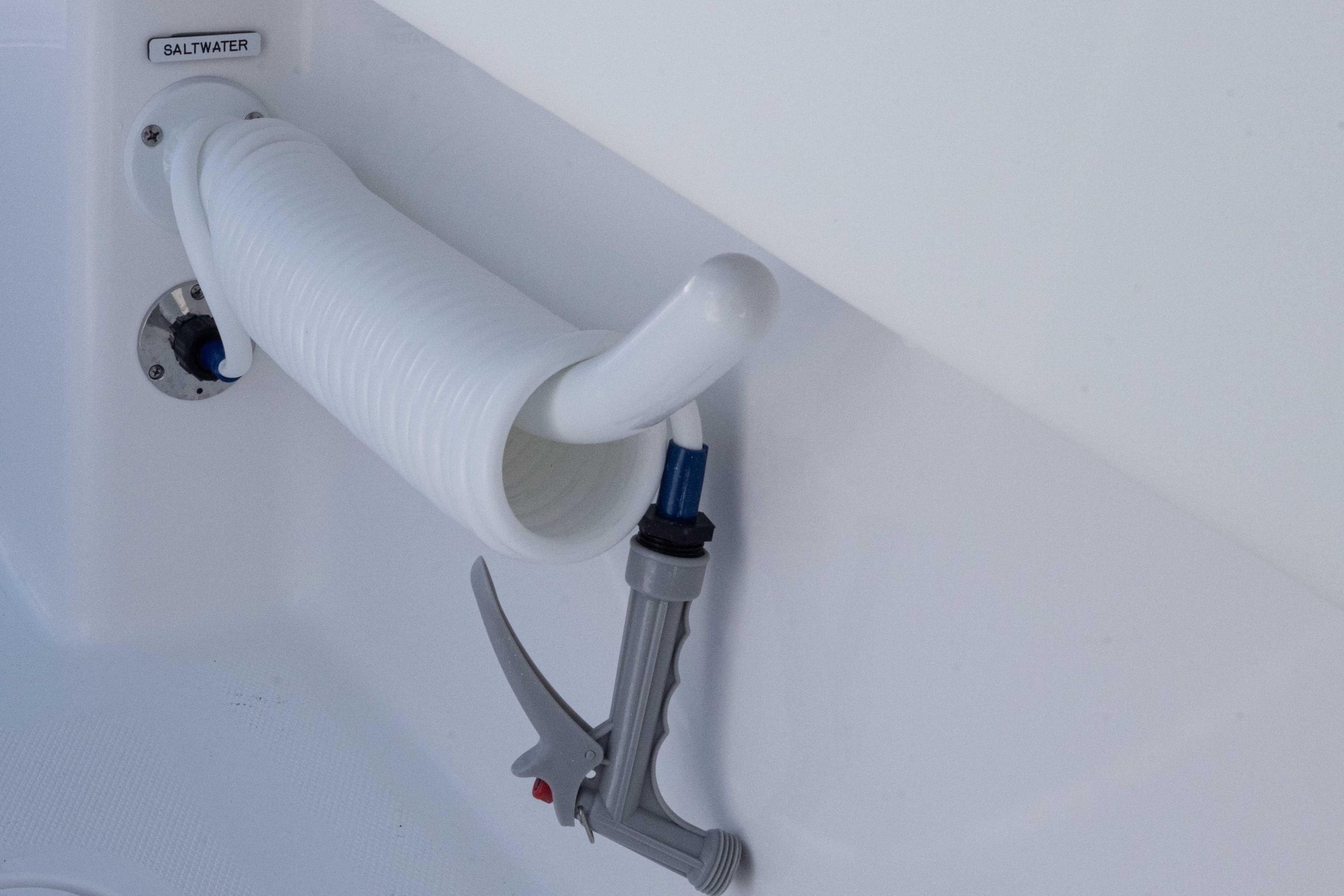 Saltwater hose and nozzle on 2025 Invincible 35 Catamaran boat.