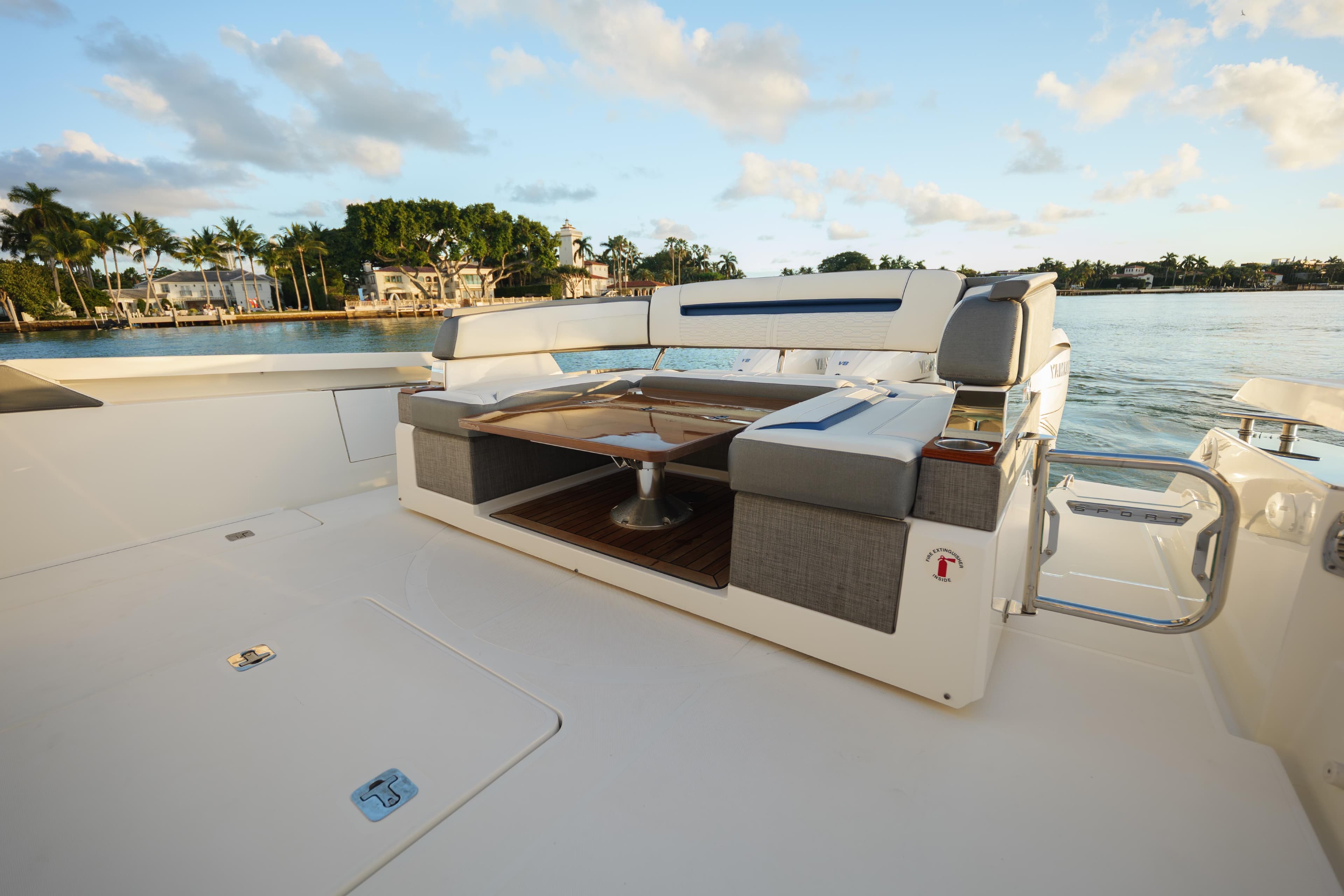 2020 Tiara Yachts 43 LS luxury yacht deck with seating, overlooking serene waterfront.