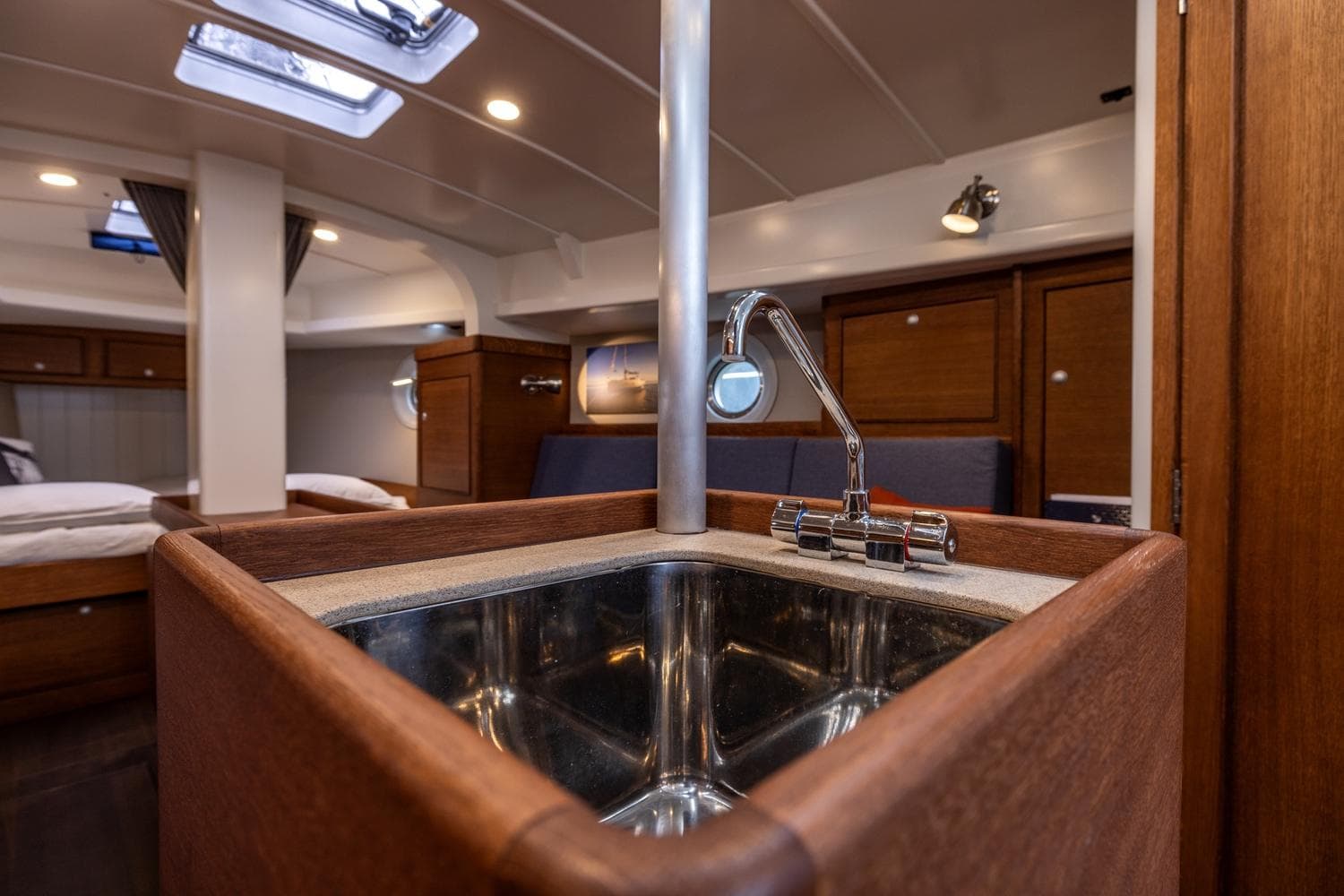 Interior of 2023 Bestevaer 36 yacht, featuring a modern sink and wooden cabinetry.