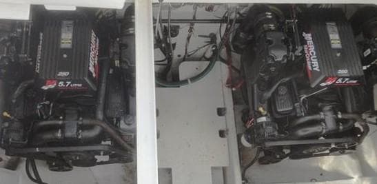 Twin Mercury engines in a 2001 Bayliner 3055 Ciera boat engine compartment.