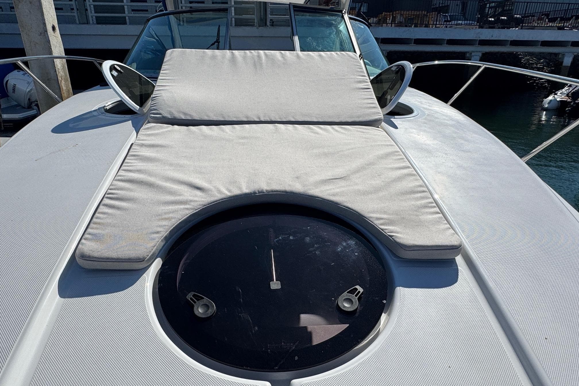 2026 Regal 33 XO yacht with sunpad and hatch on deck.