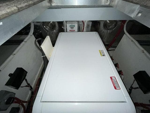 Engine room of 2008 Carver 43 Super Sport yacht, featuring mechanical components and ventilation.