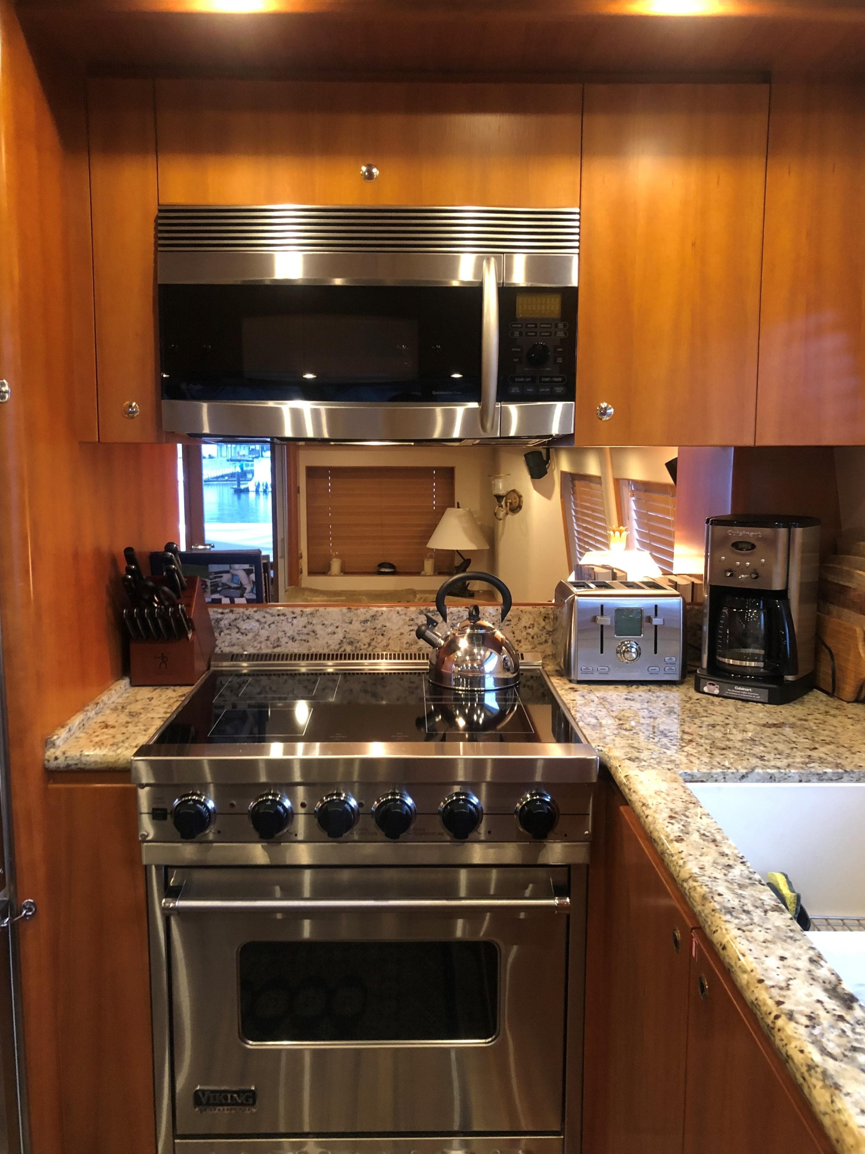2007 West Bay Yacht Fisherman kitchen with stainless steel appliances and granite countertops.