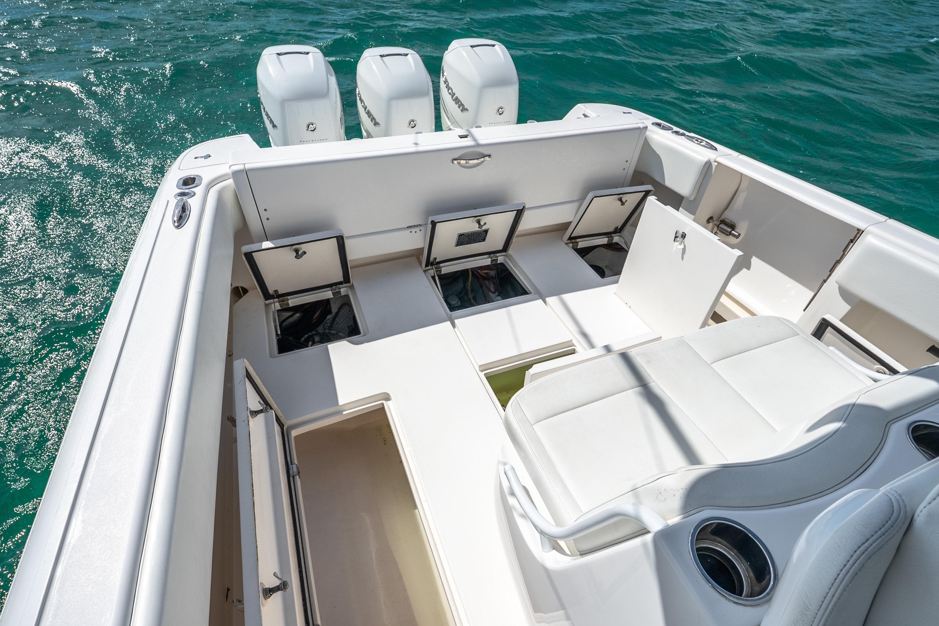 2016 Intrepid 400 Center Console boat with open storage compartments on deck.