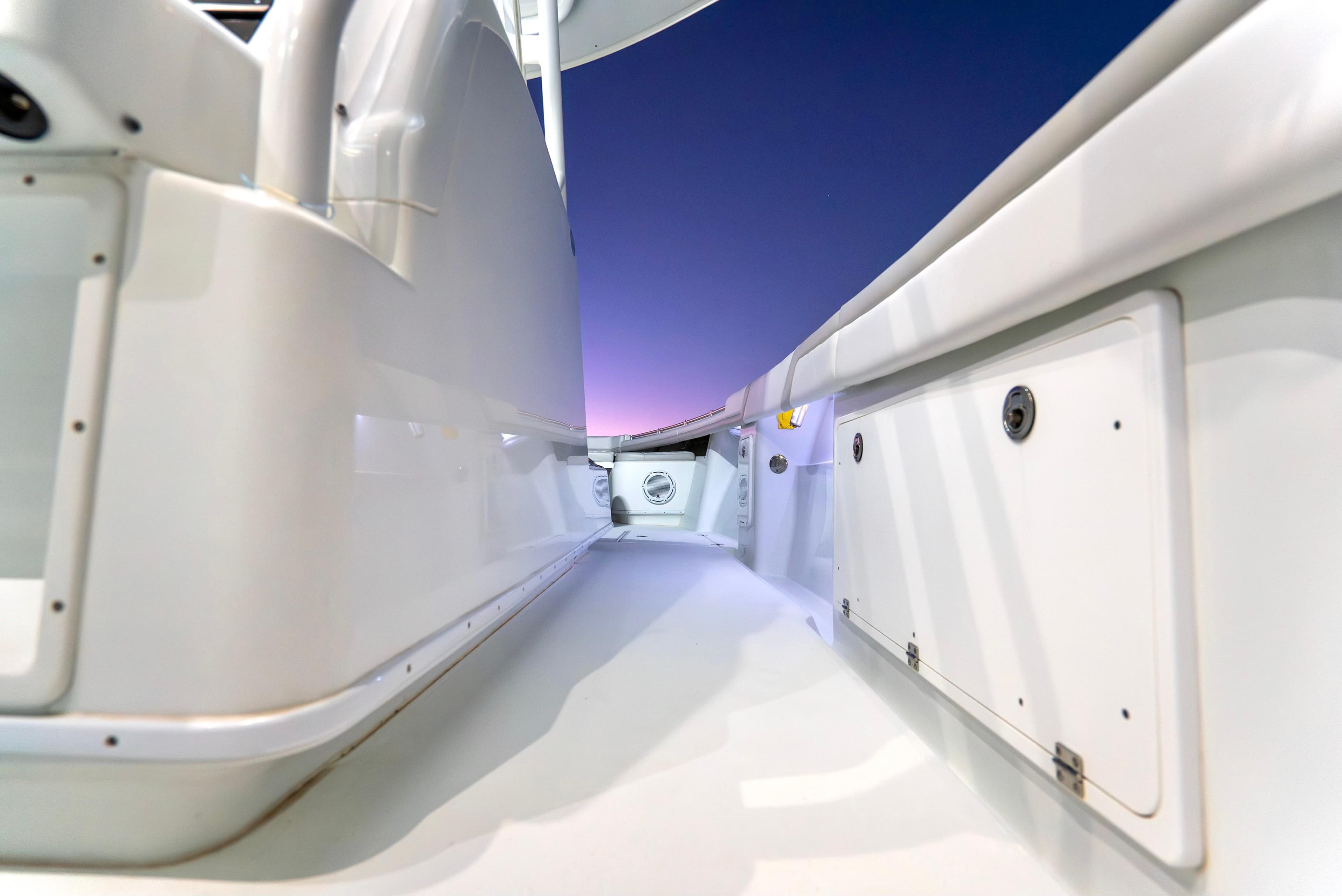 2016 Yellowfin 39 Offshore boat interior at sunset, showcasing sleek white design.