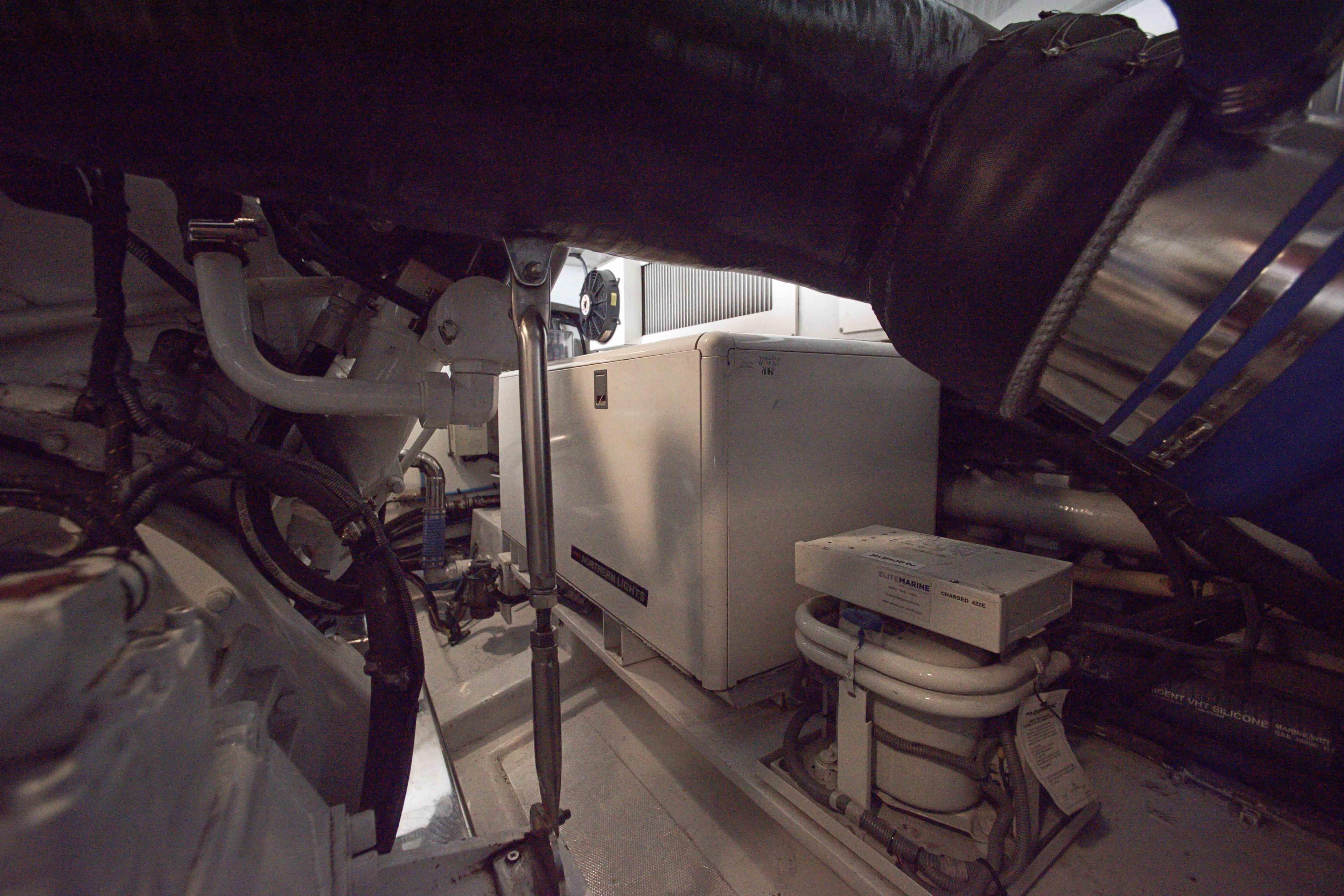 Engine room of 2009 Marlow 78E yacht with visible machinery and equipment.