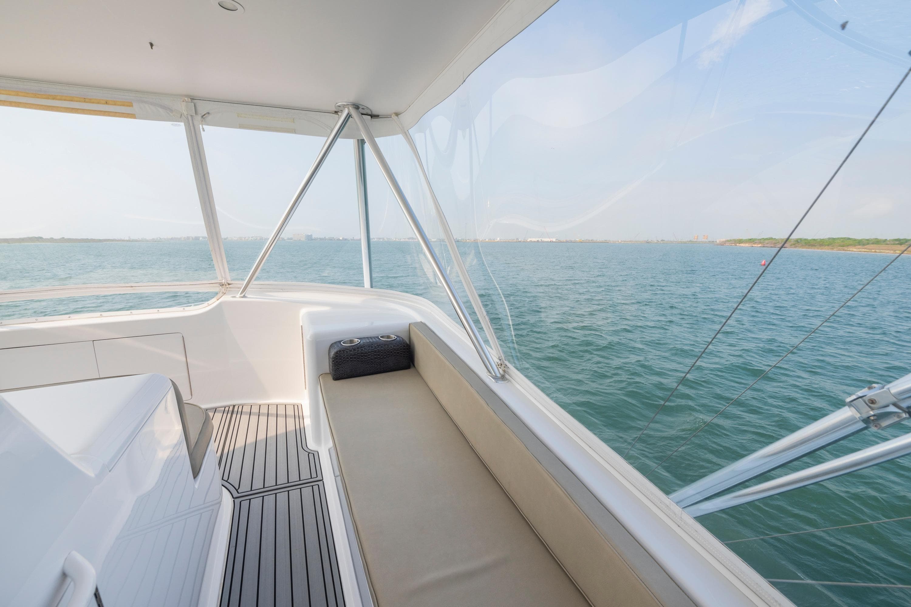 2005 Viking Convertible yacht interior with ocean view, featuring sleek seating and modern design.