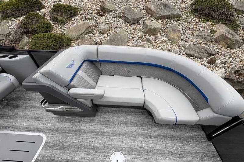 2026 Bennington 22 M Quad Bench boat interior with sleek gray seating and blue accents.