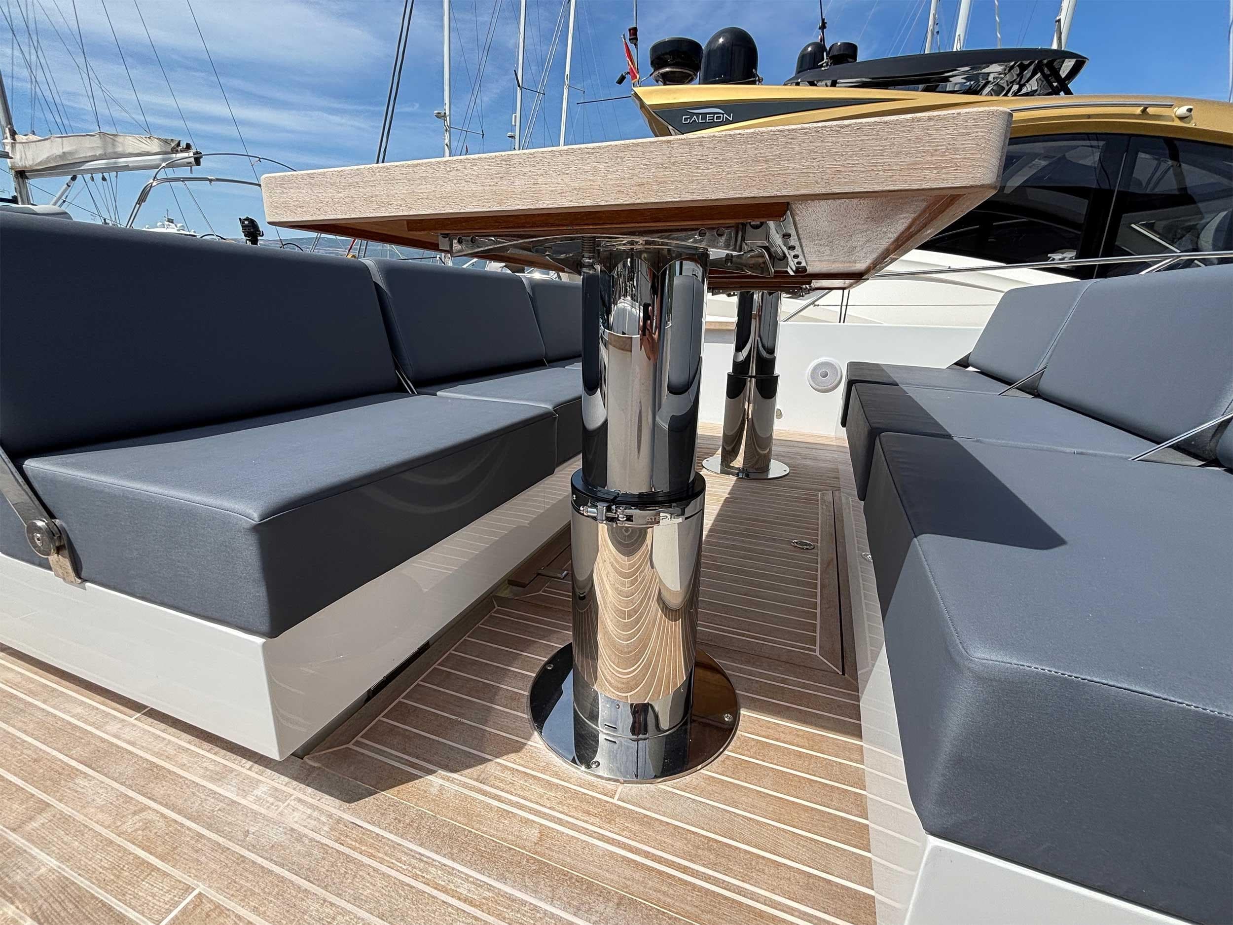 2024 Fiart 43 Seawalker yacht interior with sleek seating and polished table.