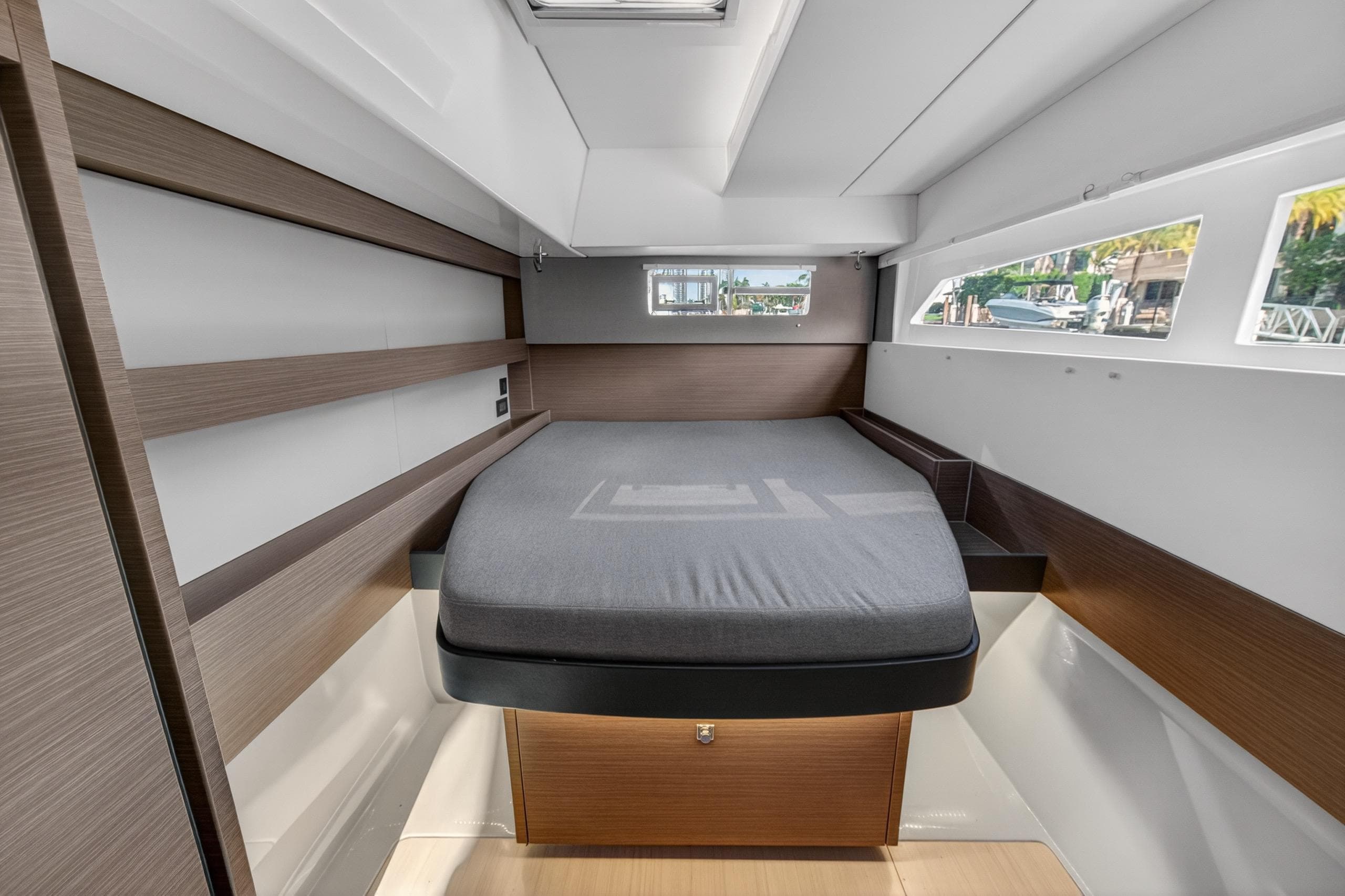 Modern cabin interior of 2022 Leopard 50 yacht with sleek design and comfortable bed.